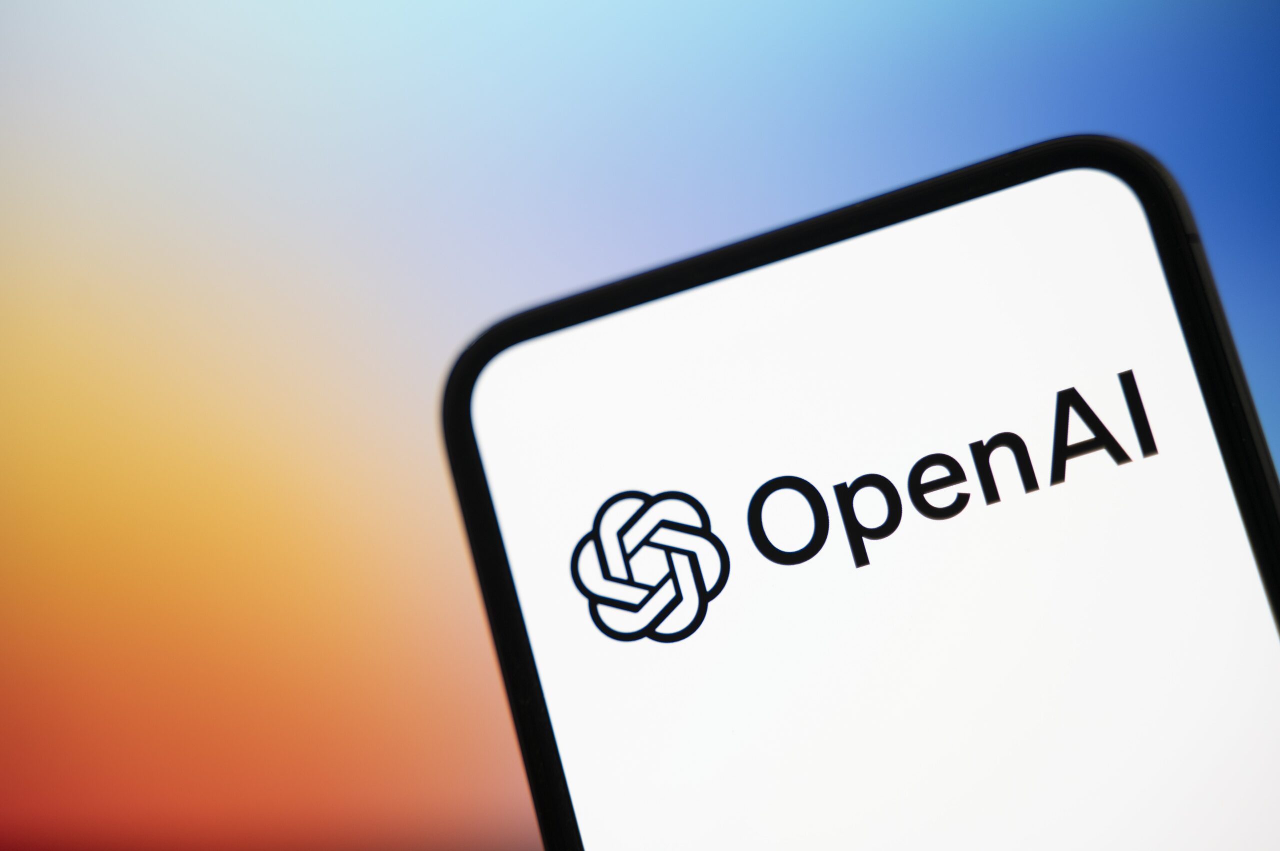 OpenAI logo on mobile device