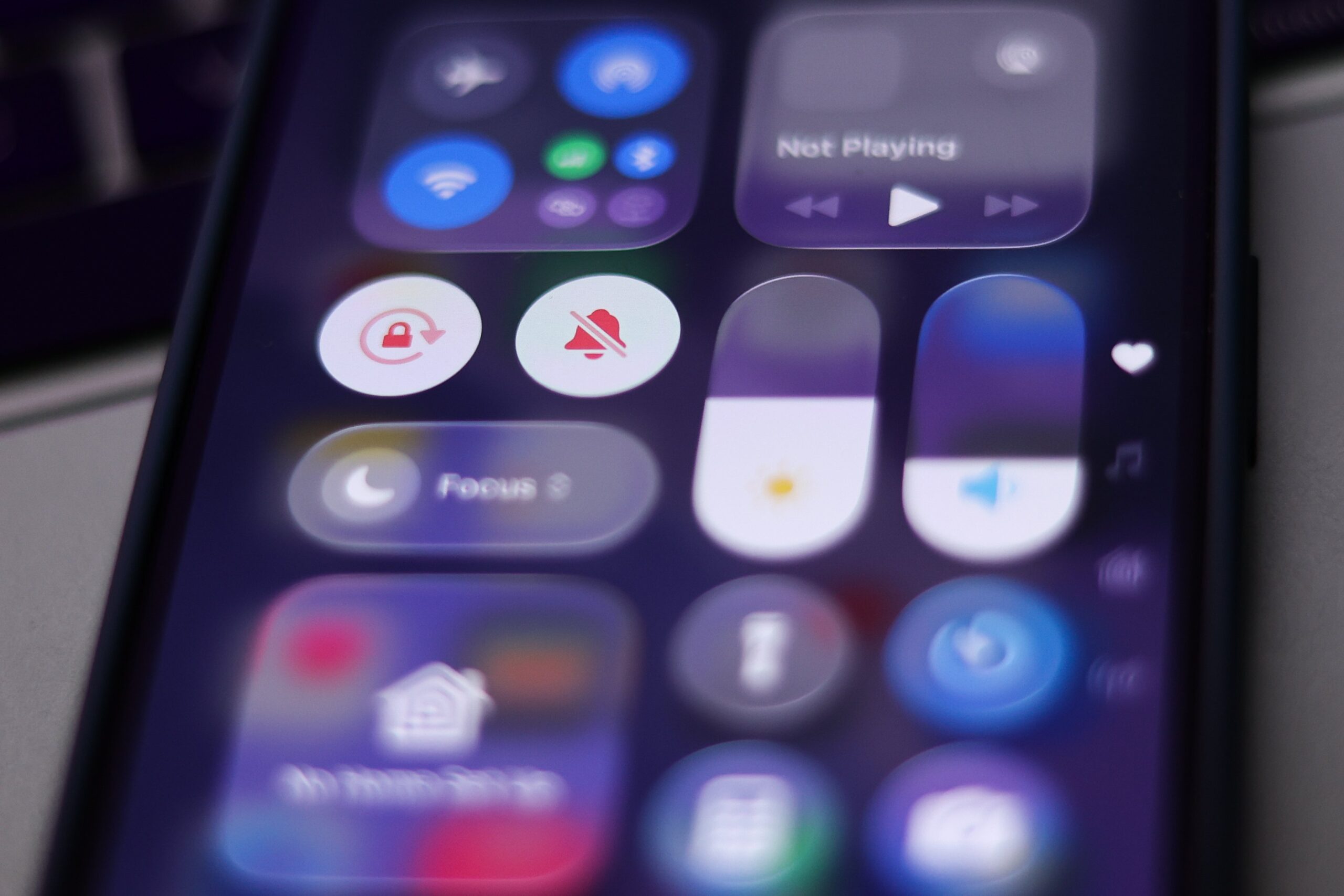 A close up shot of the new iOS 26 control center. 