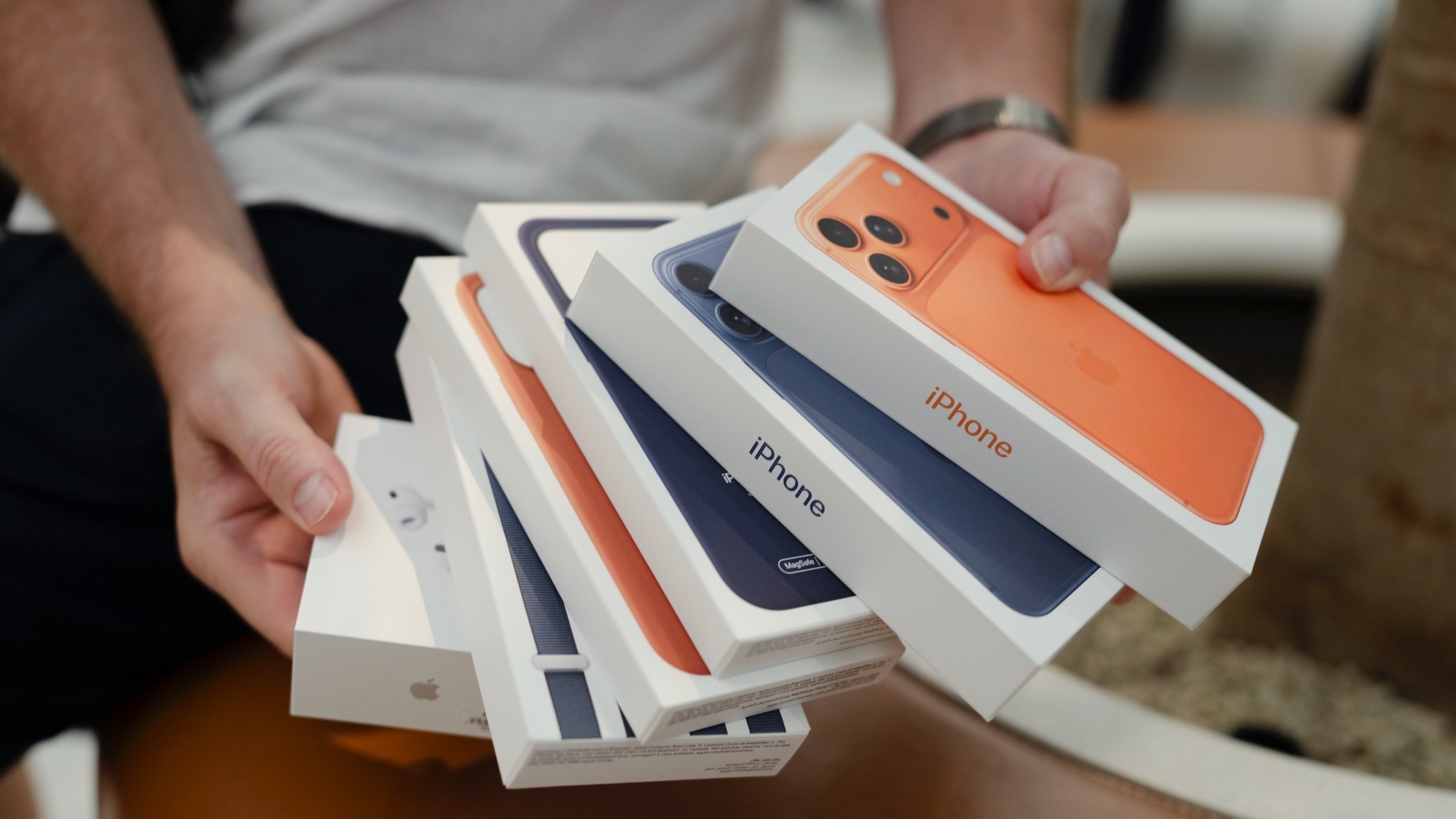 A person holds Apple's new iPhone 17 Pro Max boxes in apple store
