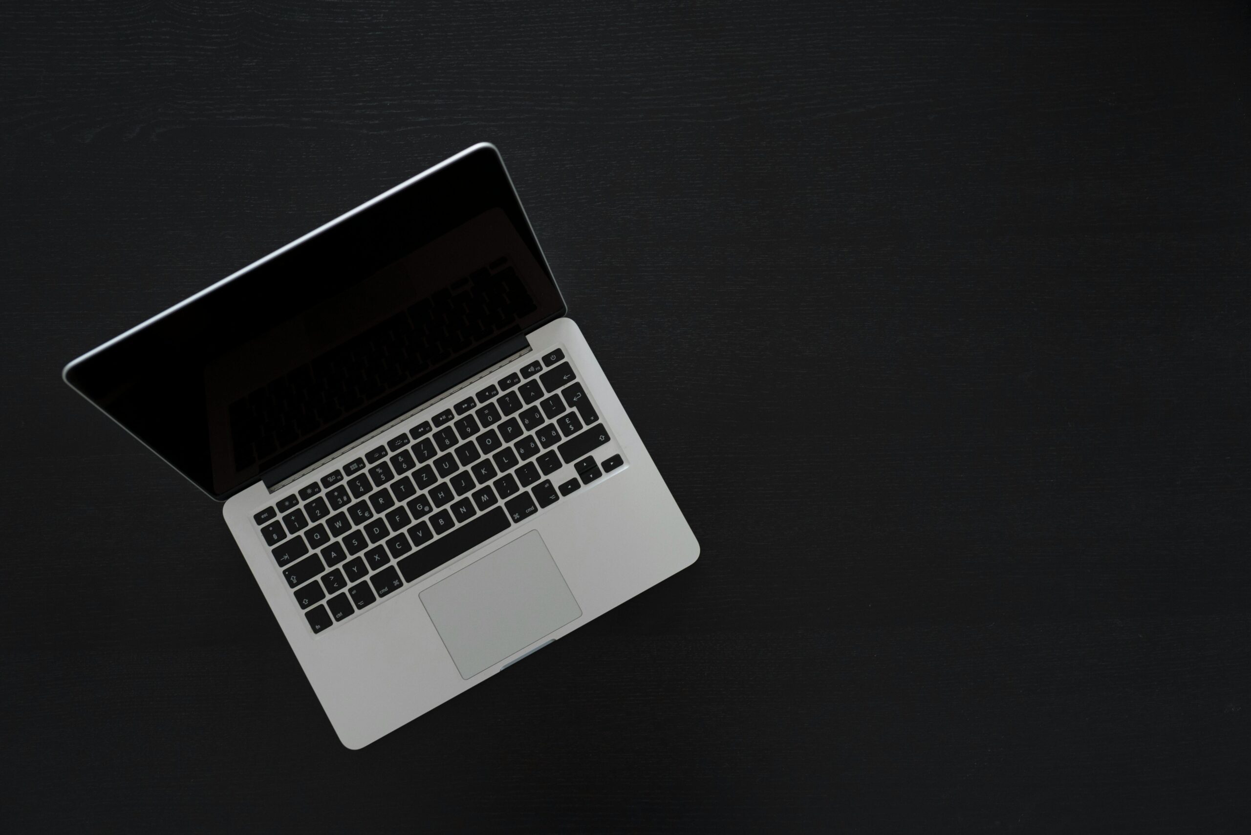 Laptop on black surface