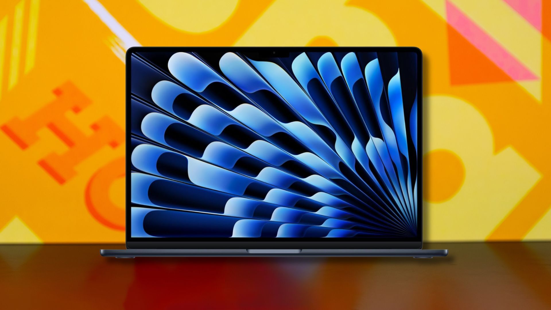 apple 2025 macbook air against a yellow patterned background