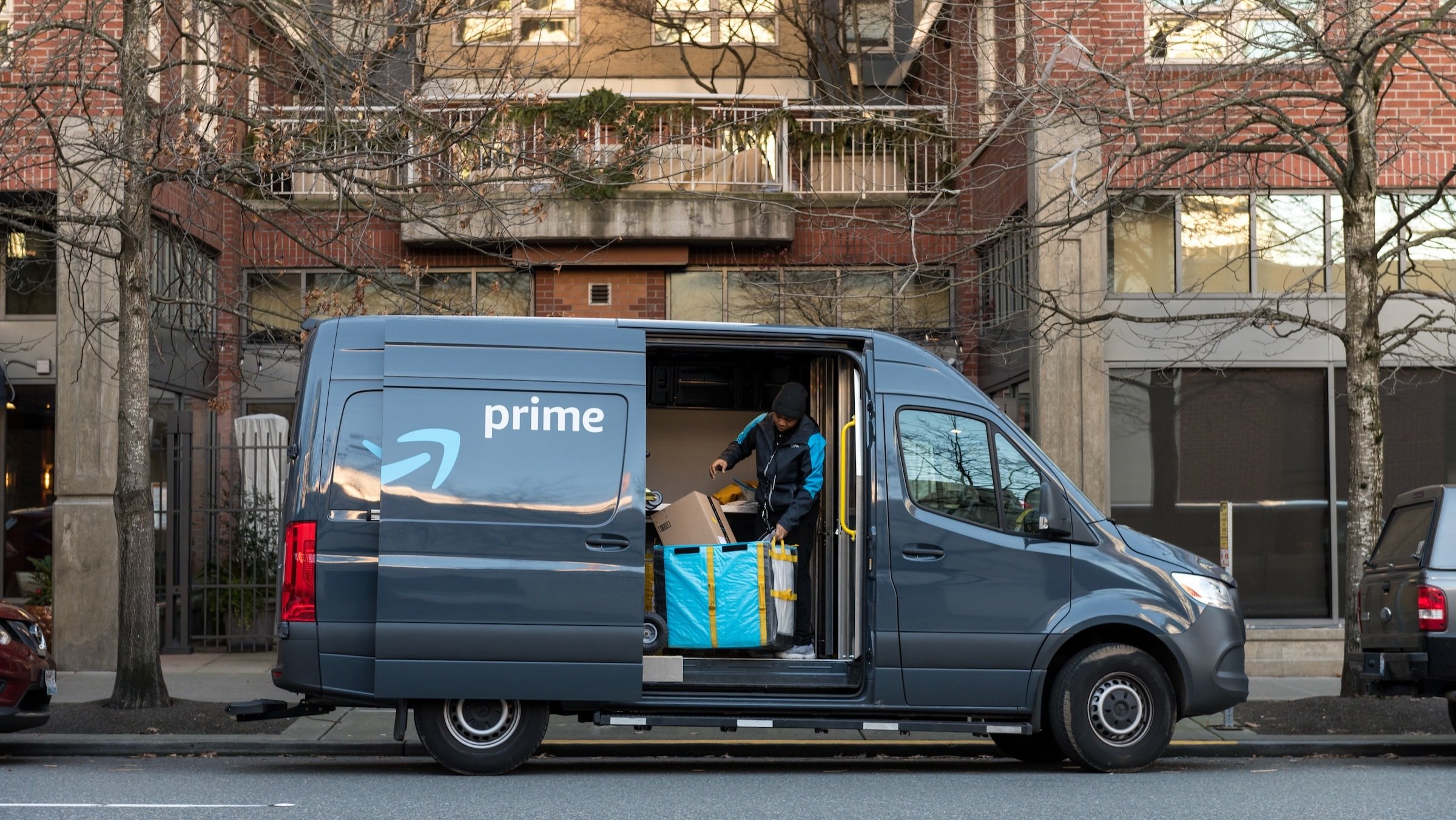 Amazon Prime Now Delivery van and driver delivering packages in new york city