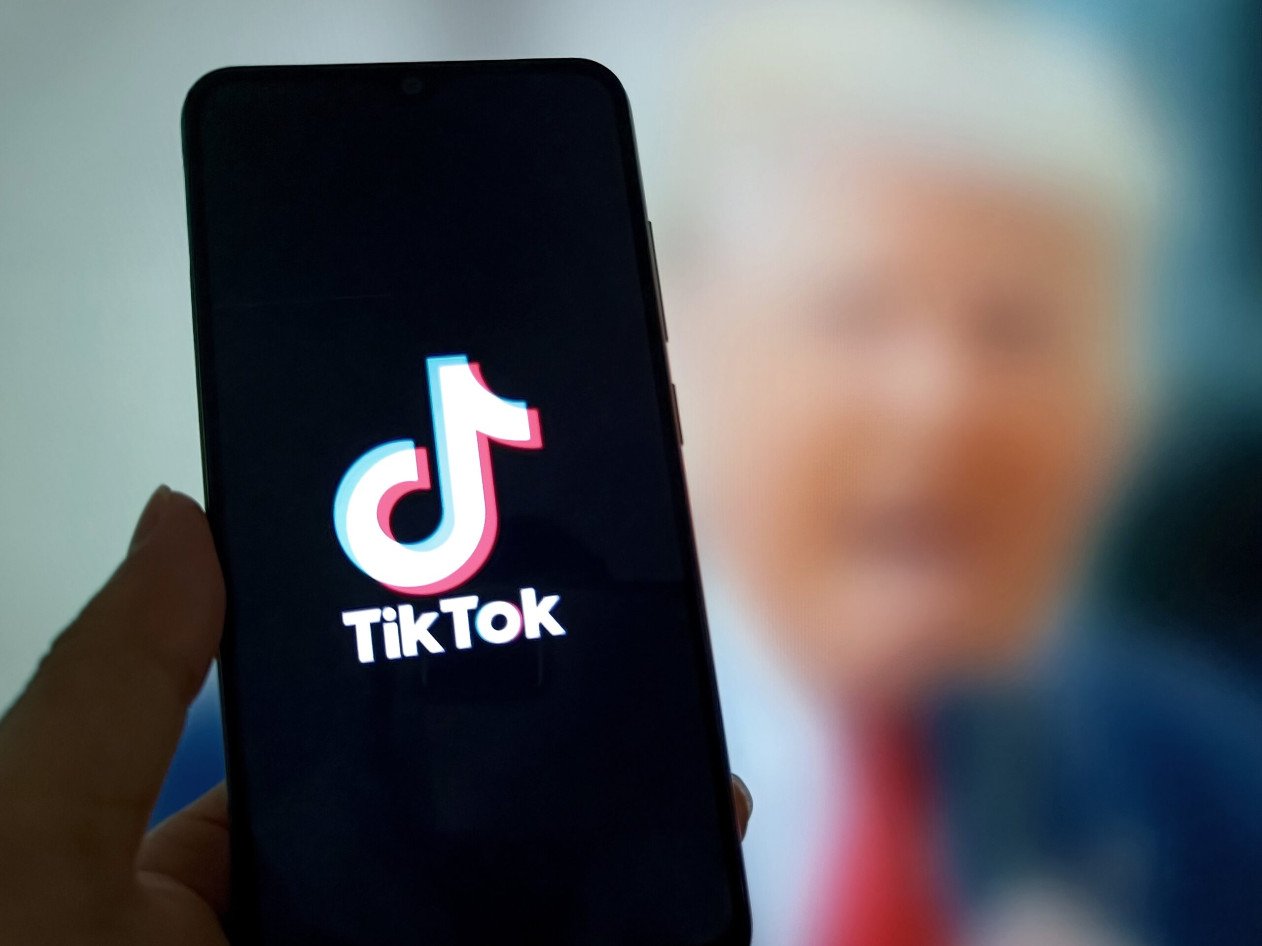 The logo of TikTok is displayed on a smartphone screen on March 27, 2025 in Suqian, Jiangsu Province of China. US President Donald Trump announced on April 4 that he will again postpone enforcement of the TikTok sale-or-ban law for 75 days.