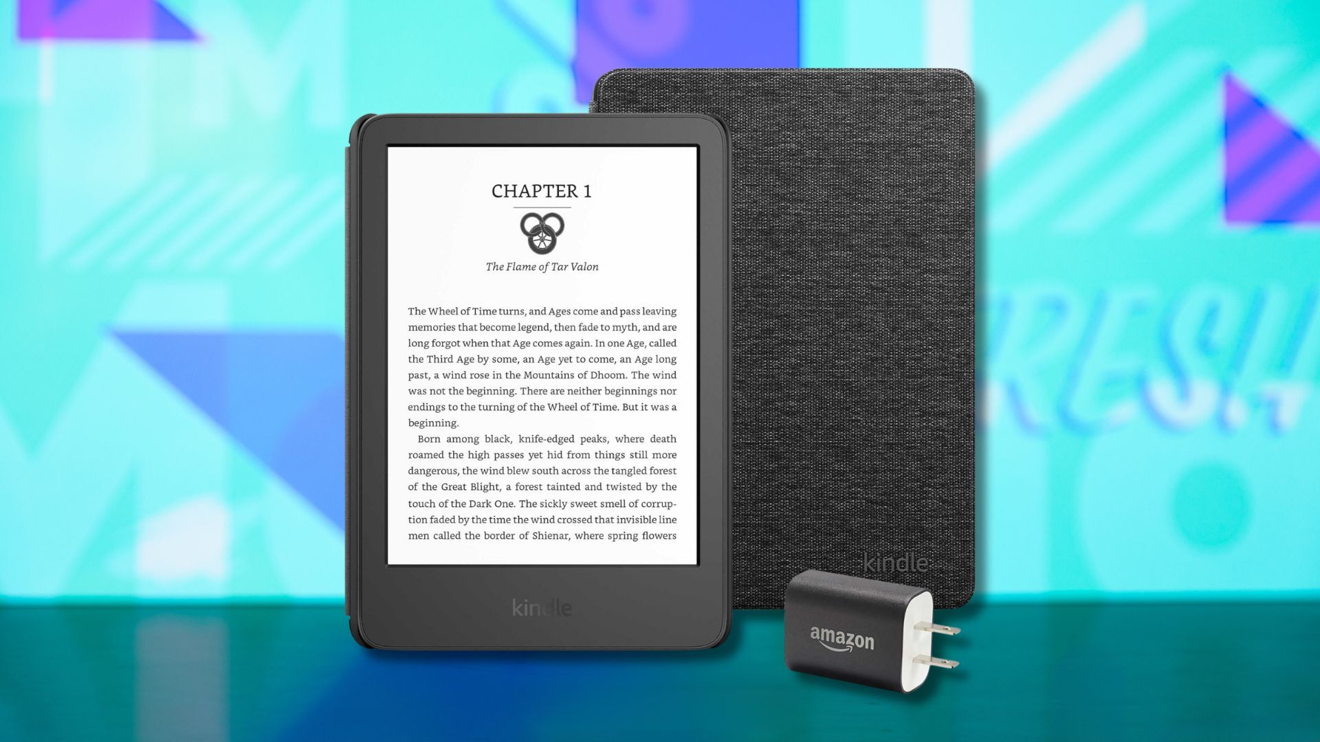 a kindle, fabric cover, and power adapter against a light blue patterned background