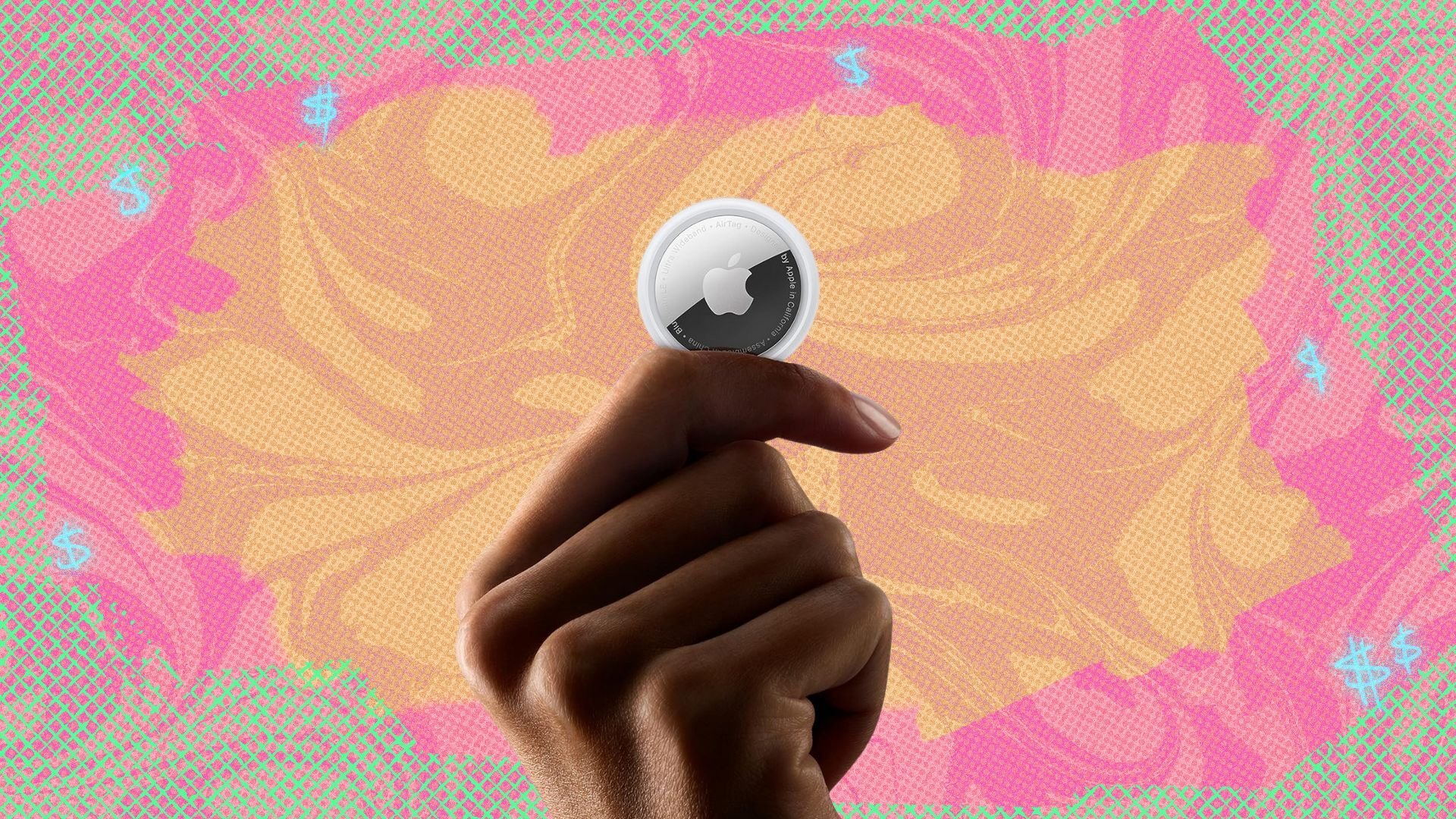 apple airtag held between fingers on colored background