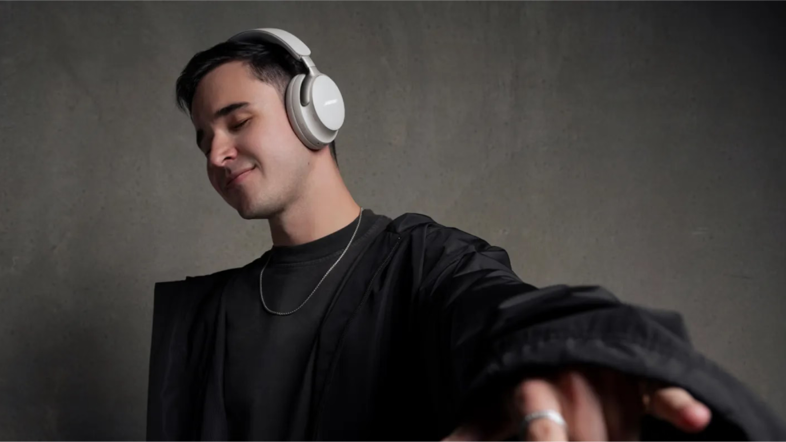 man wearing Bose QuietComfort Ultra headphones