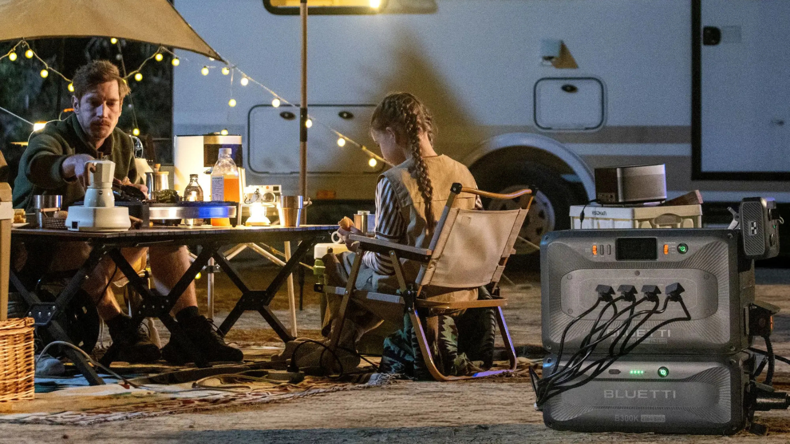 father and daughter enjoying campsite with Bluetti solar generator hooked up