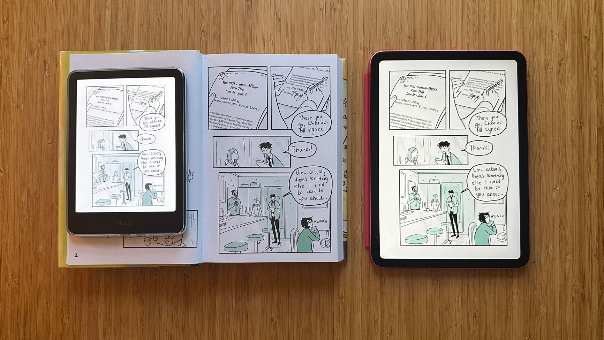 A Kindle Colorsoft on a book next to an iPad, all showing the same page of a book.