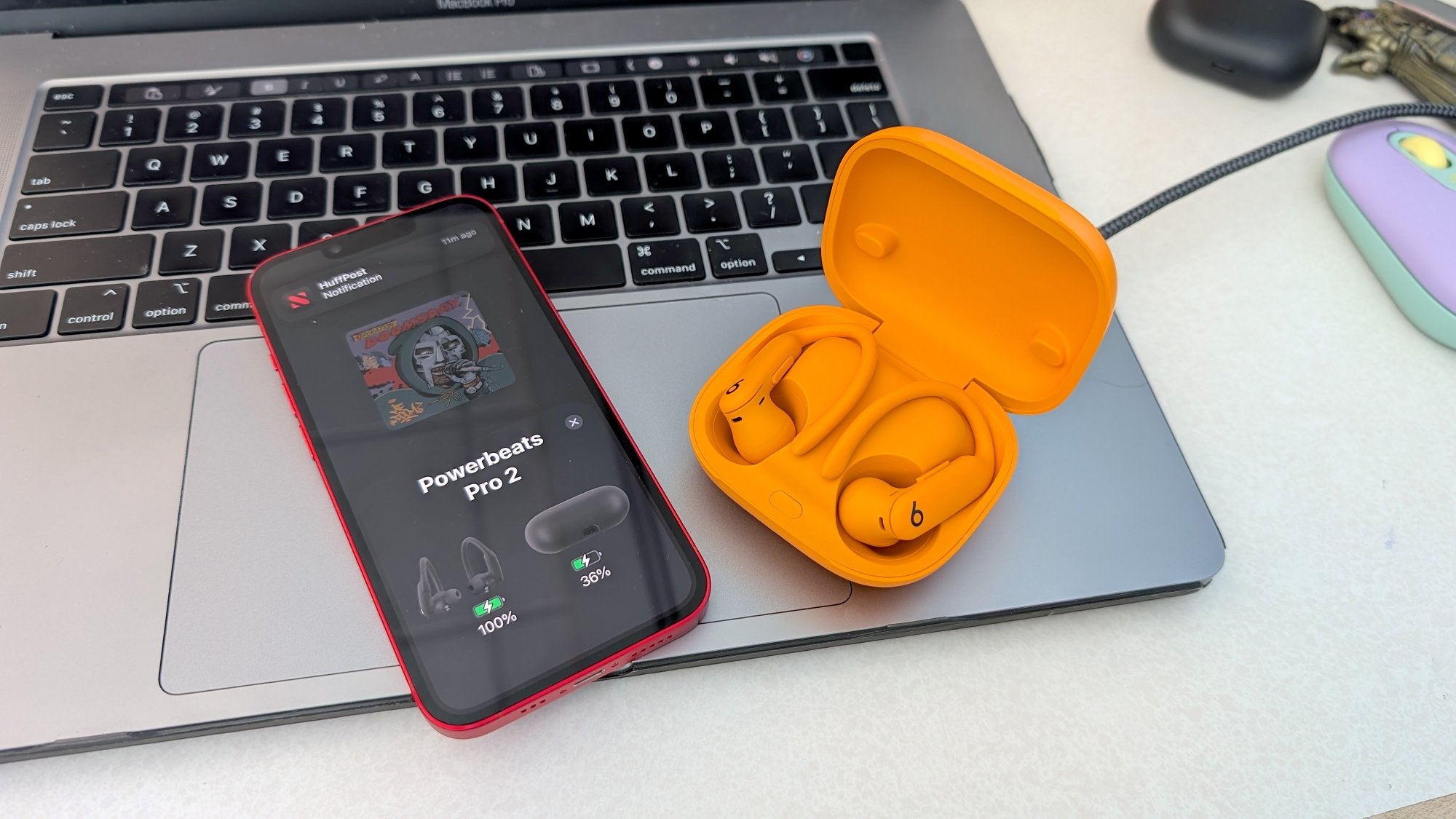 beats powerbeats pro 2 earbuds in case with iPhone and Macbook