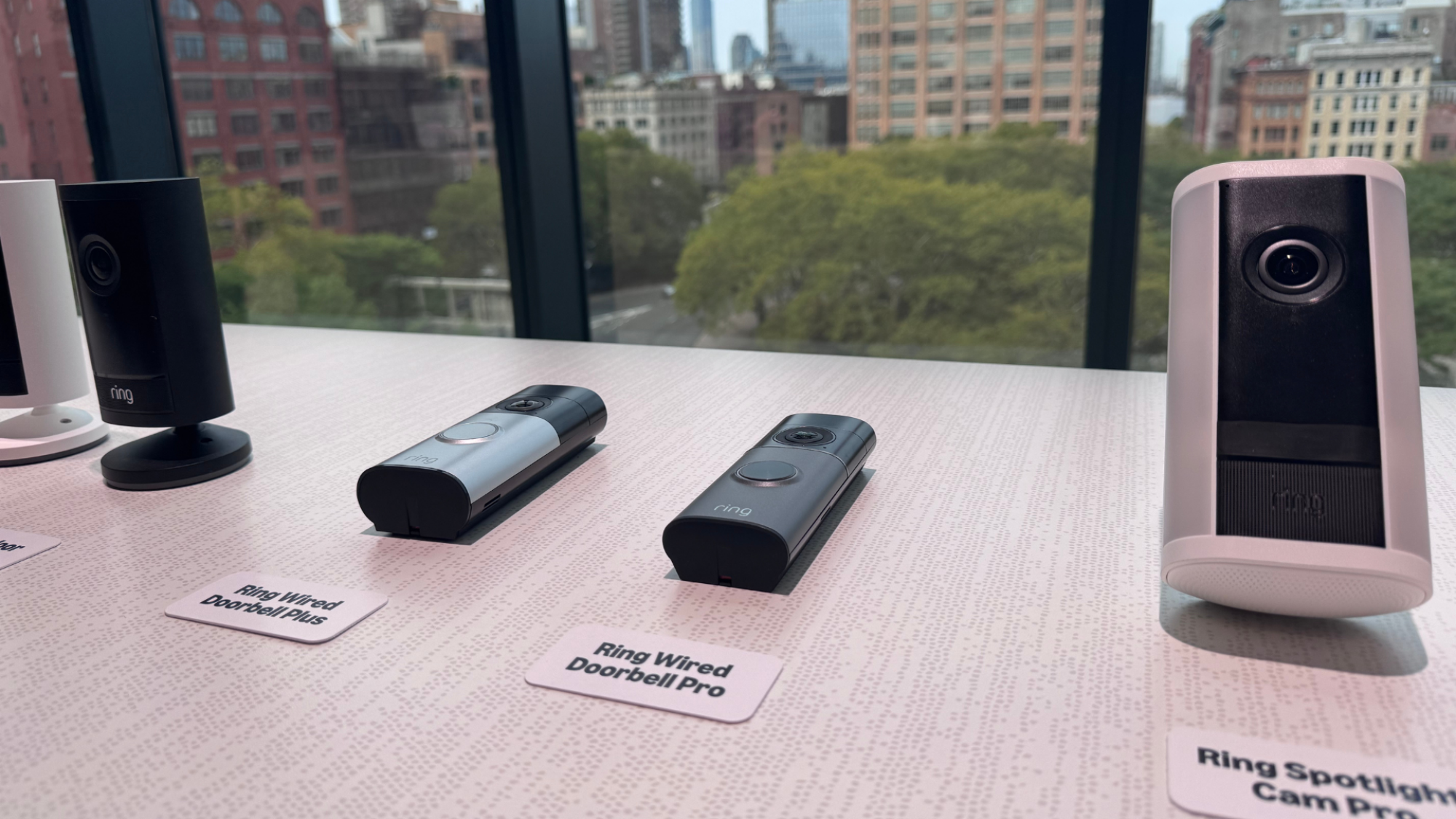 Four new Ring cameras on a table.