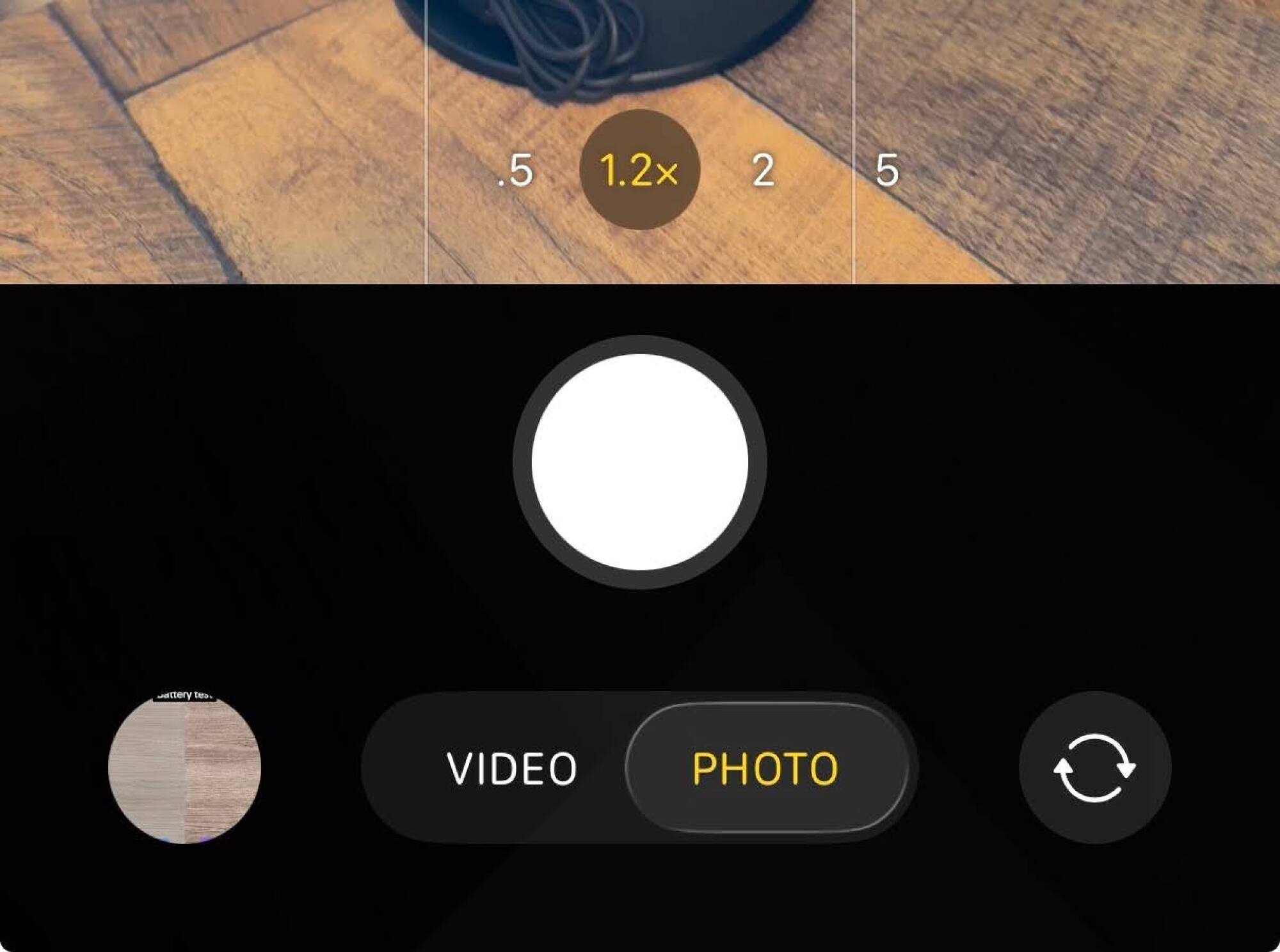 A screenshot of iOS 26's new camera app, with the options "photo" and "video" displayed prominently
