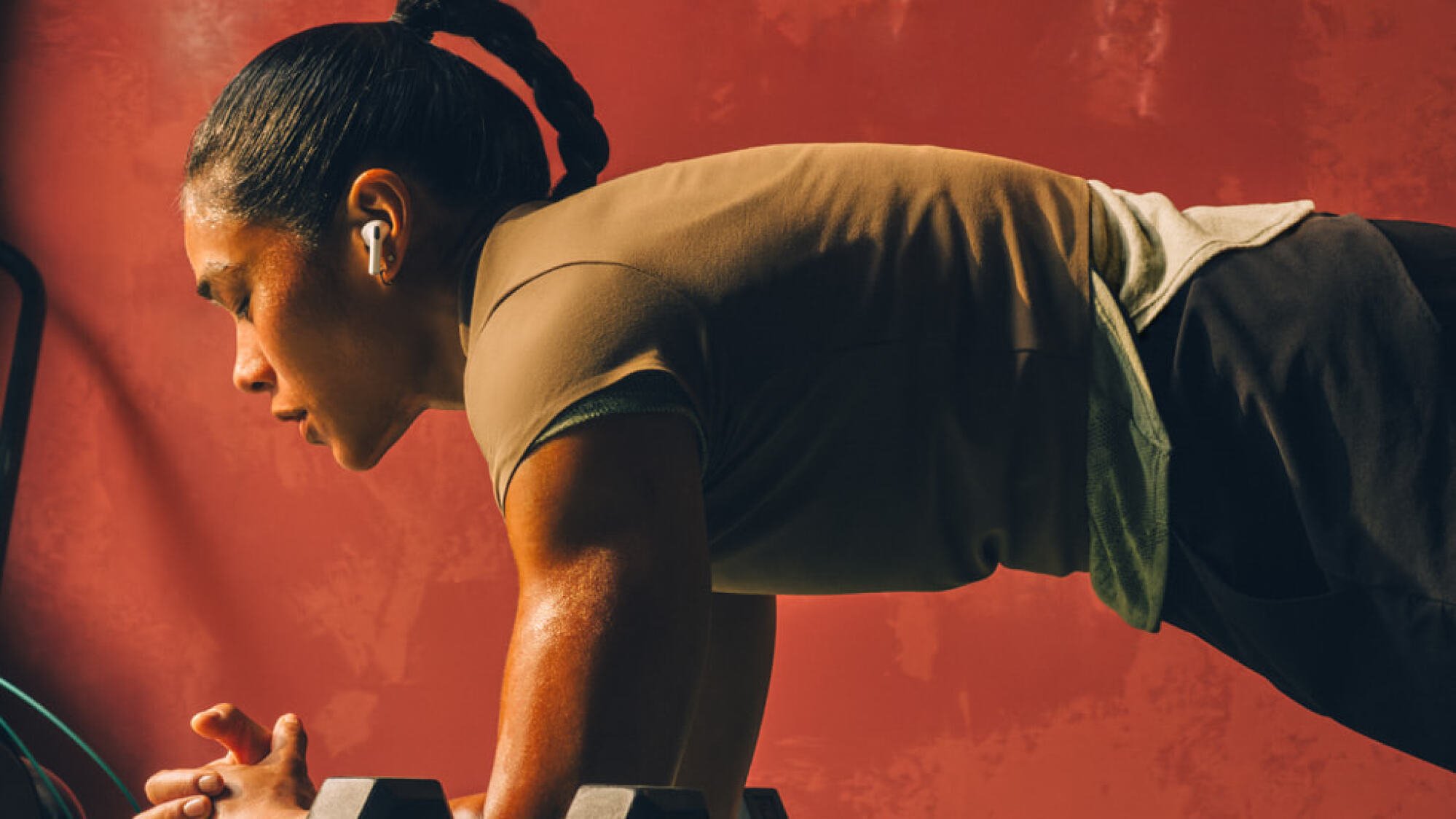 person planking while wearing airpods pro 3