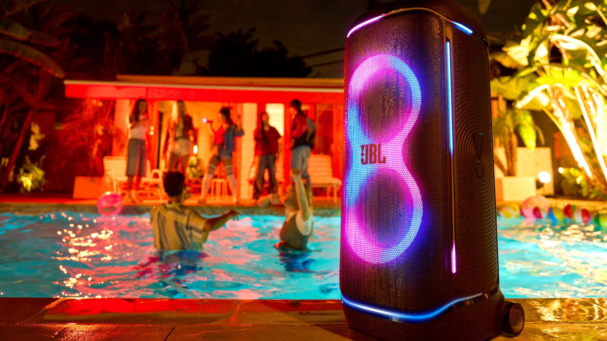 A JBL PartyBox 720 next to a pool
