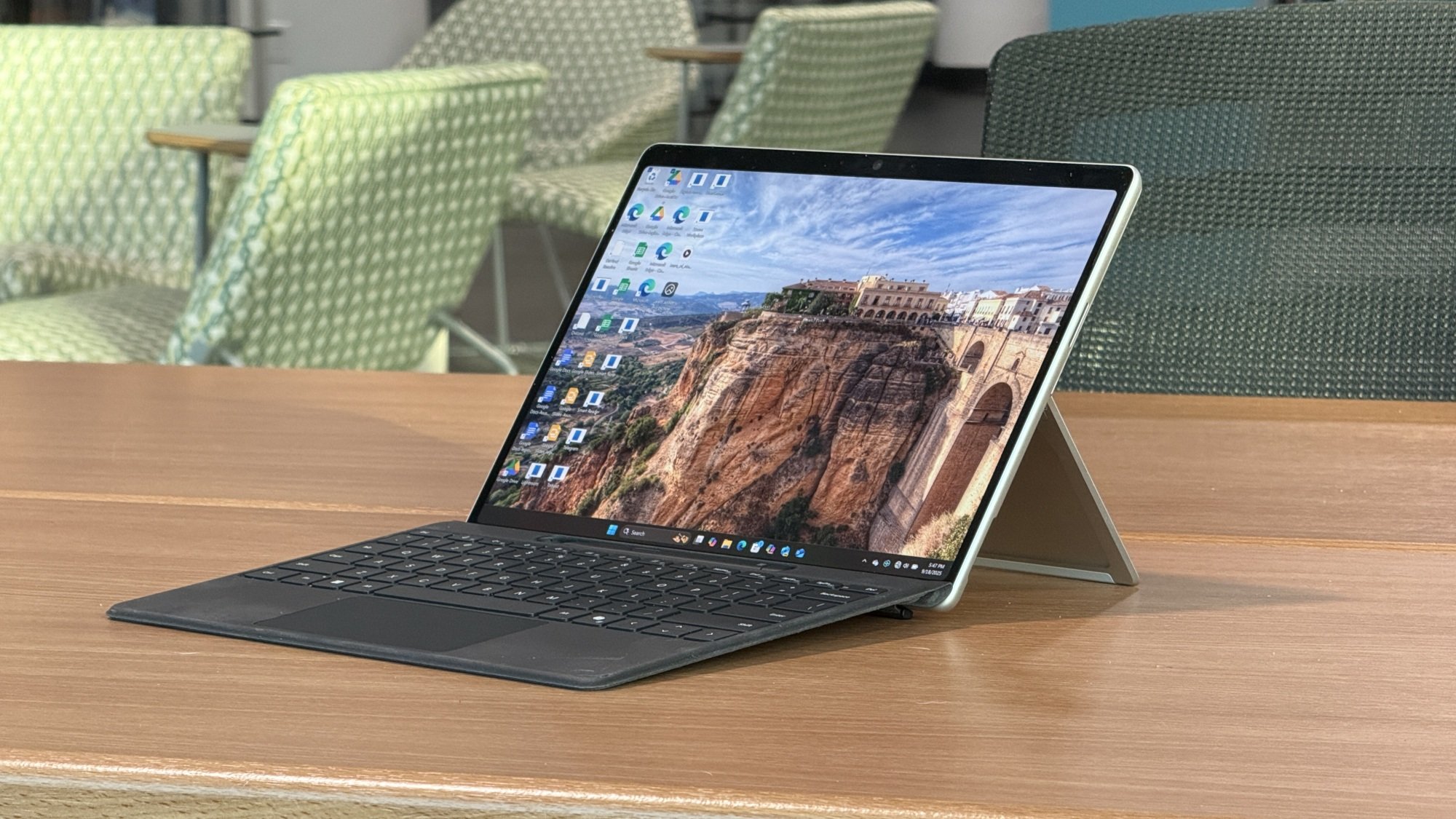 microsoft surface pro 13 laptop with keyboard on a desk