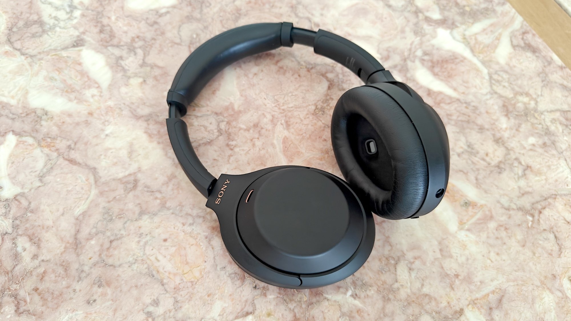 sony xm4 headphones on blanket