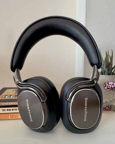 bowers & wilkins px8 s2 headphones with pile of books