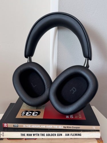bowers & wilkins px8 s2 headphones with pile of books