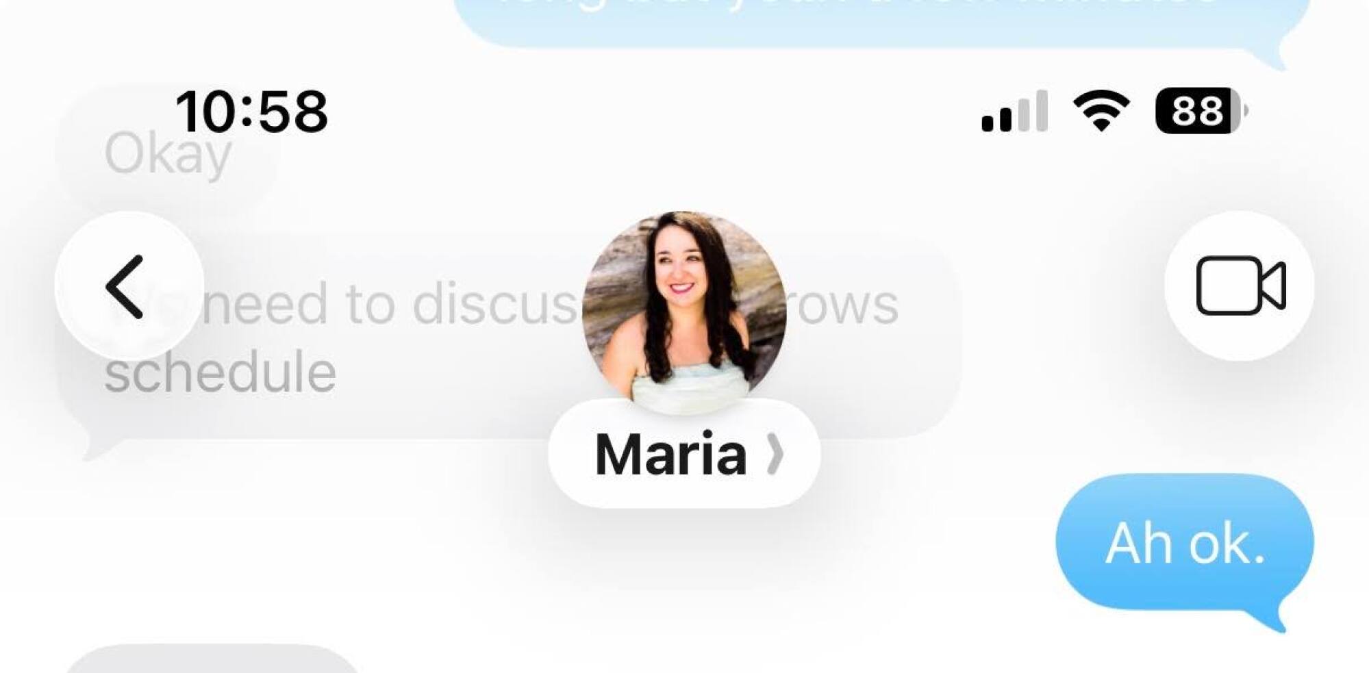 A screenshot of a contact in Messages on iOS 26, displaying simplified menu options