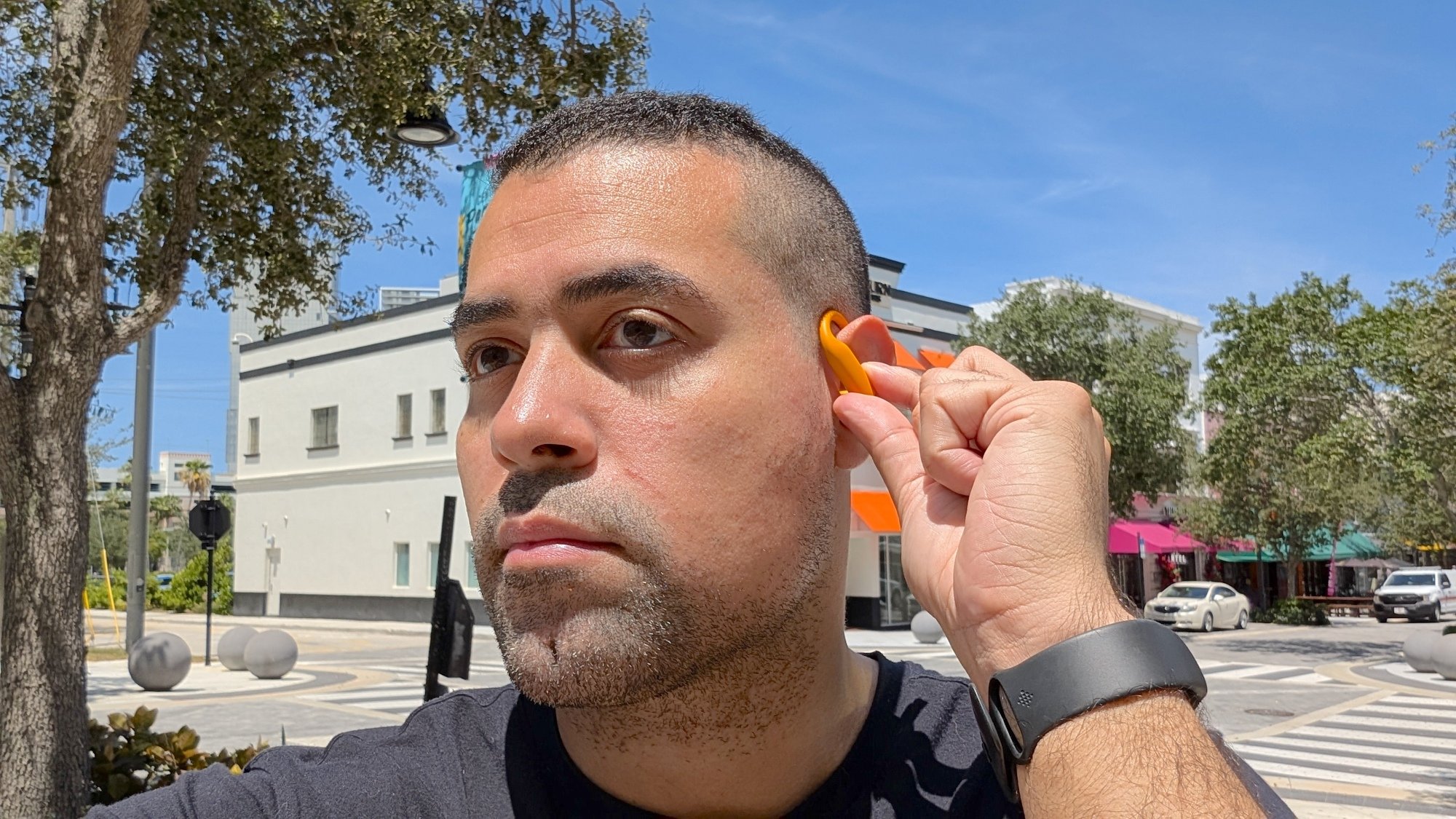 author wearing beats powerbeats pro 2 earbuds