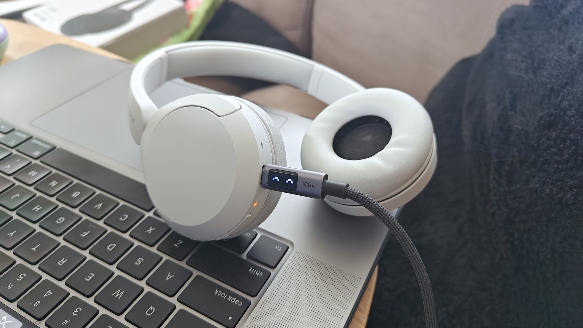 Sony WH-CH520 headphones with charging cable attached