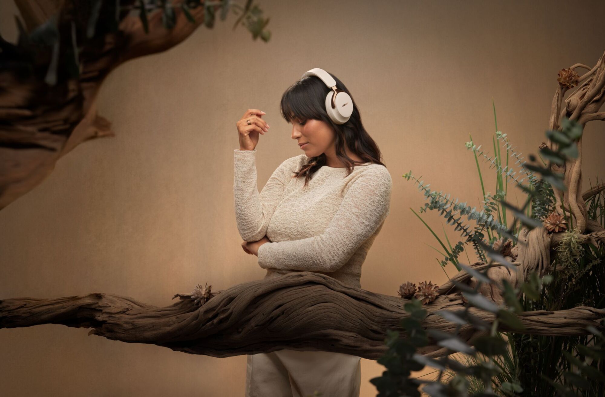 Woman wearing Bose headphones