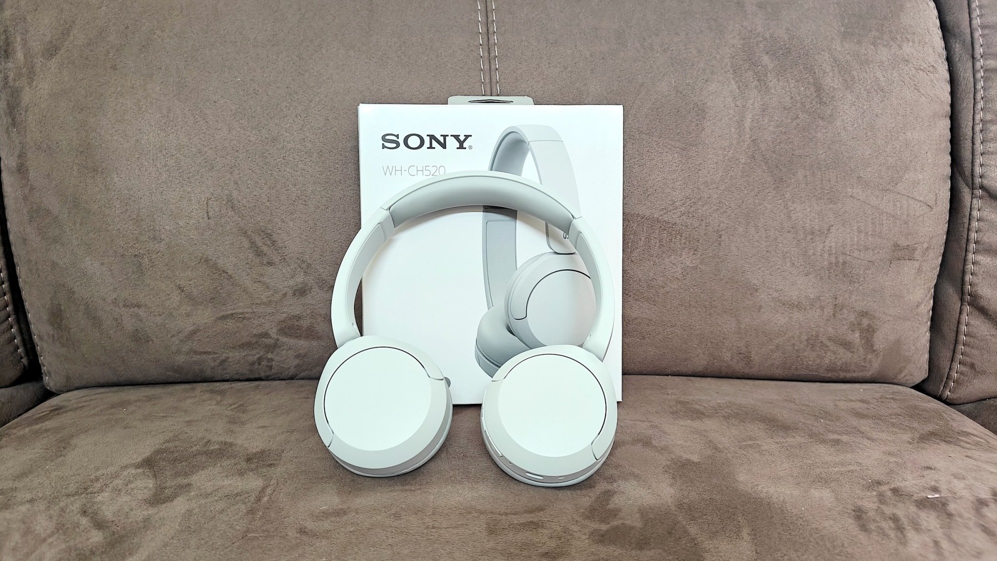 Sony WH-CH520 headphones on couch with box