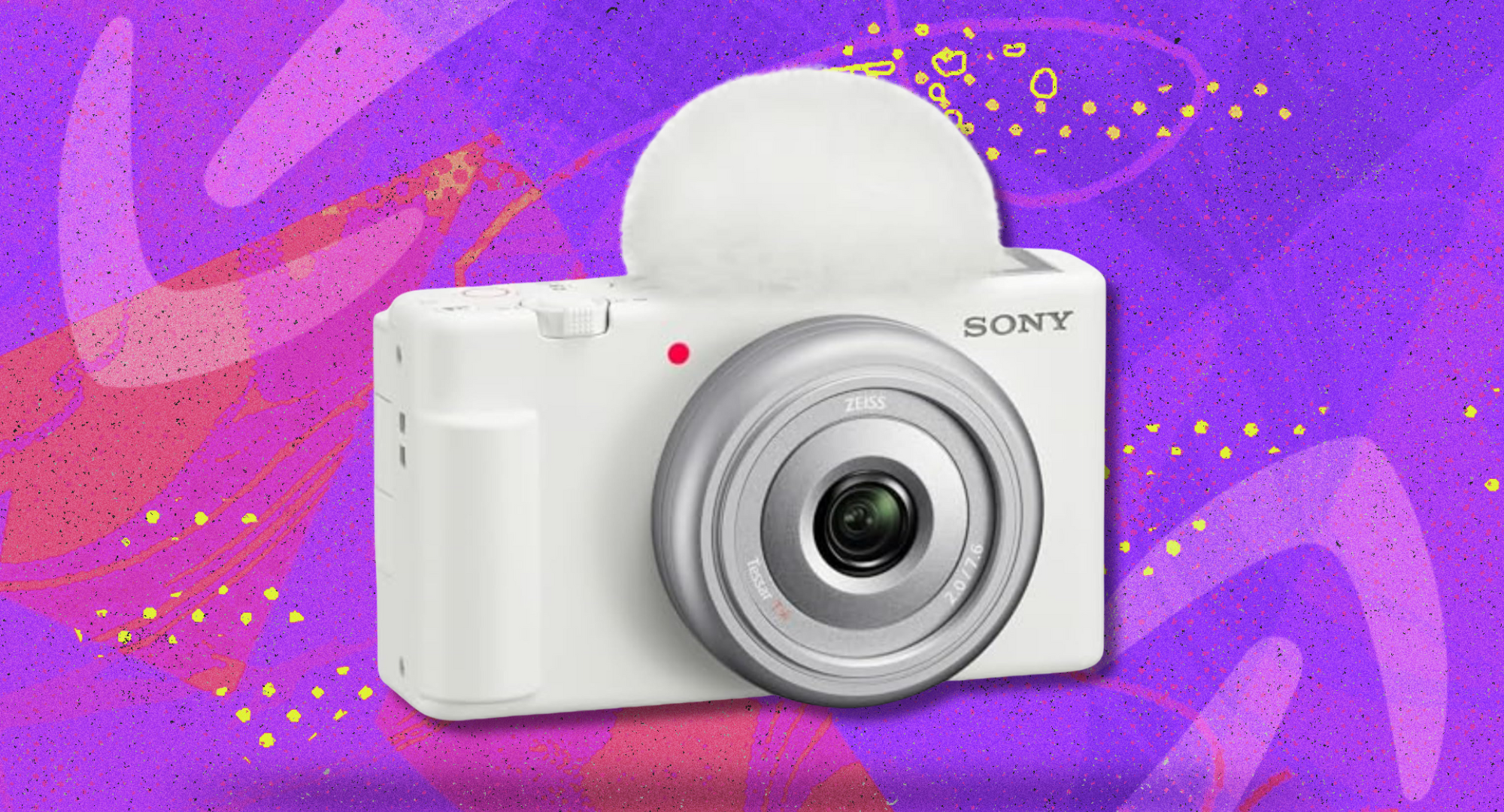 A white Sony ZV-1F Vlog Camera against a purple and pink background. 