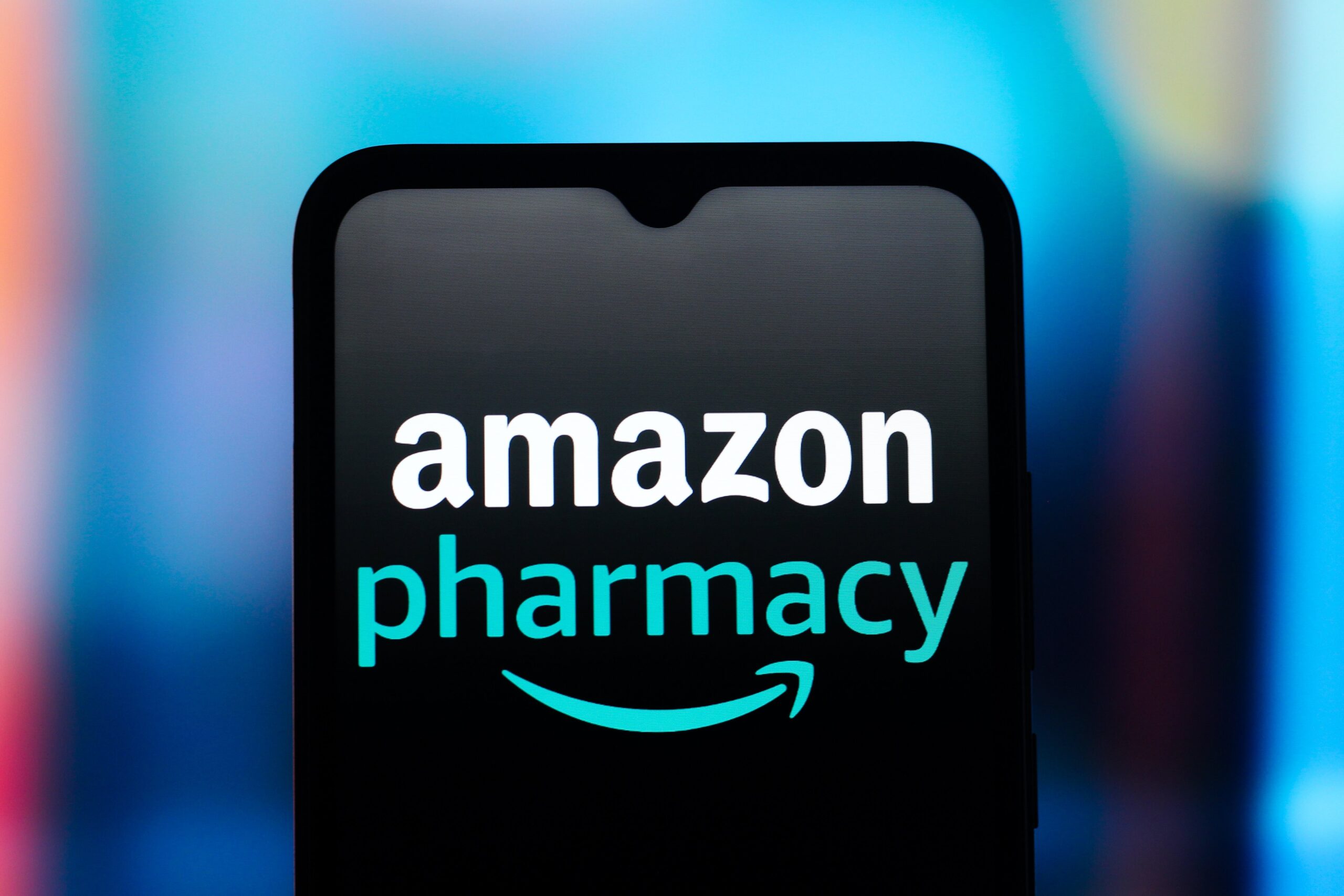 The Amazon Pharmacy logo is seen displayed on a smartphone screen.