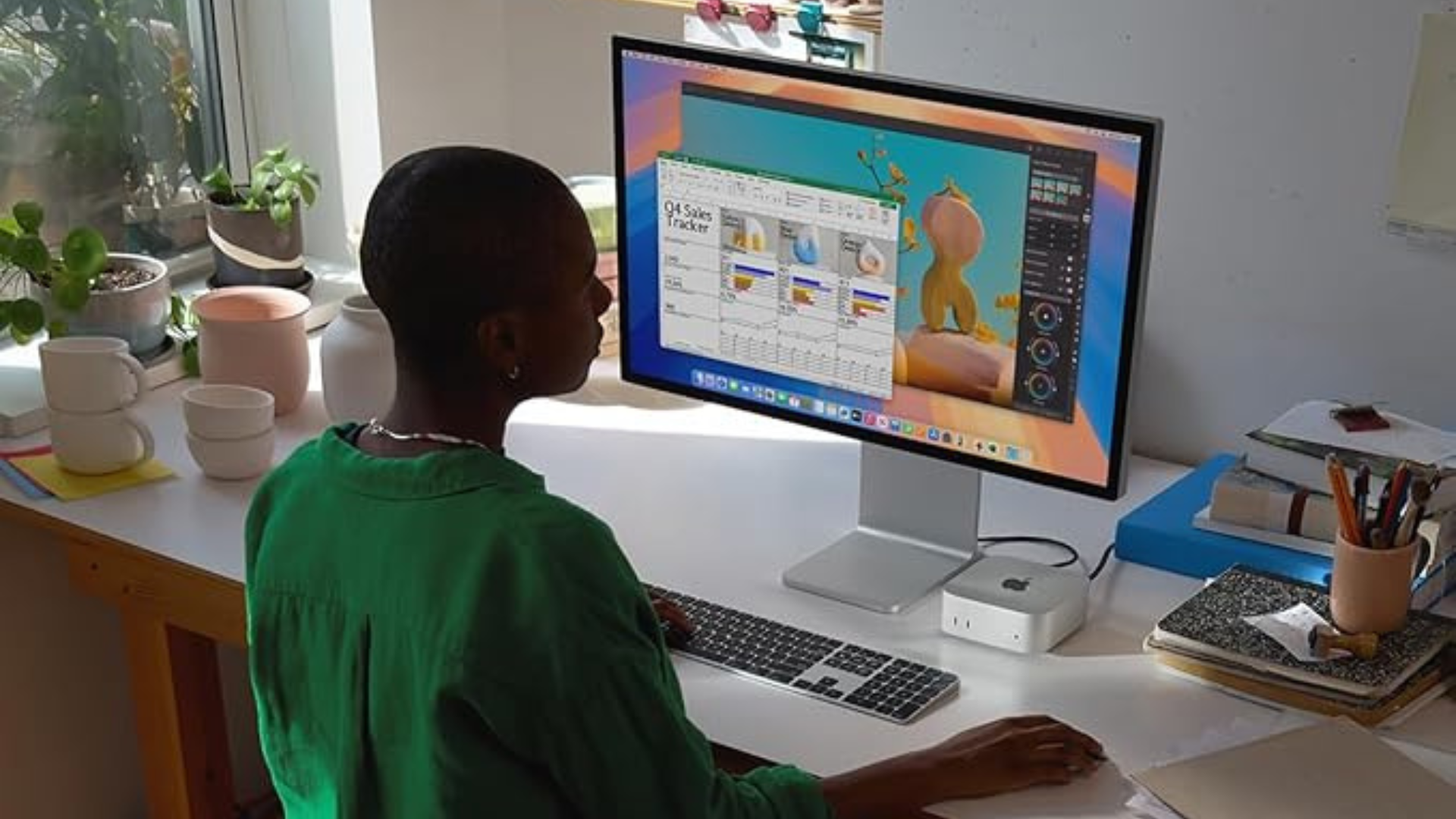 A person using an Apple Mac Mini