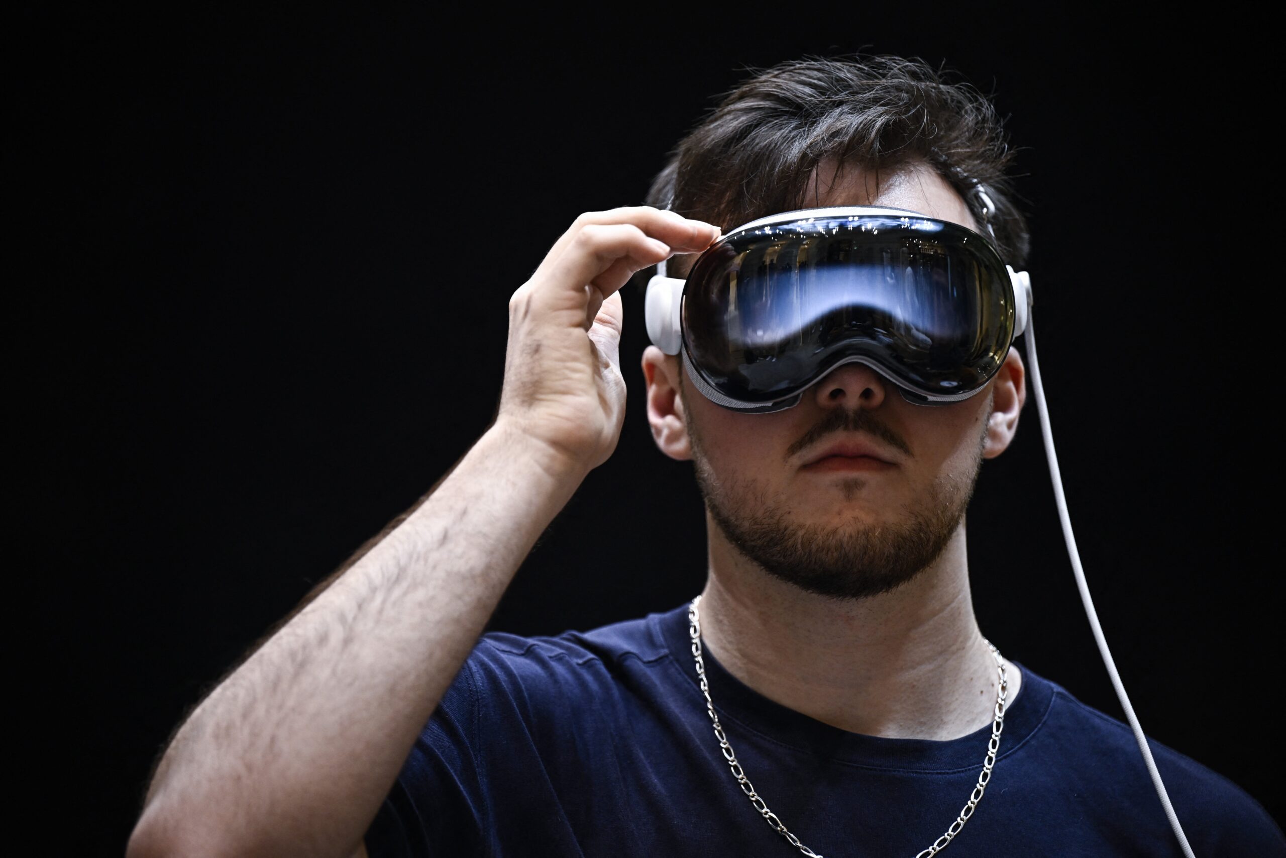 a white man wearing apple vision pro head set