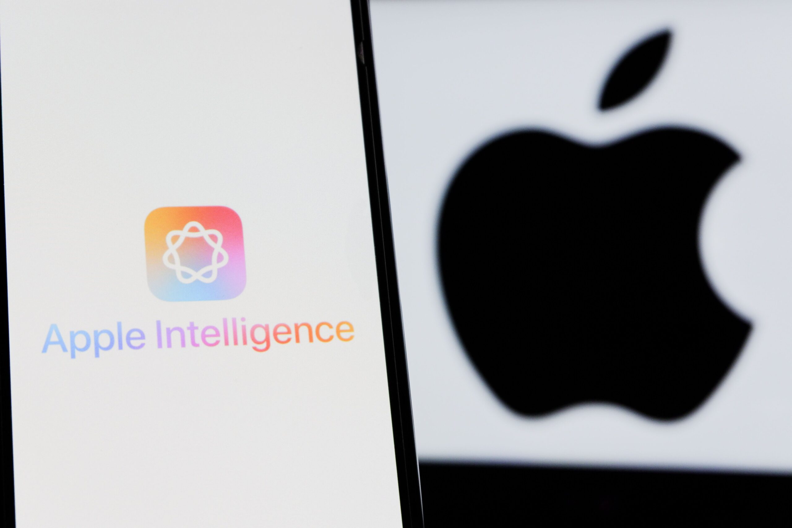 Apple Intelligence on iPhone next to Apple logo