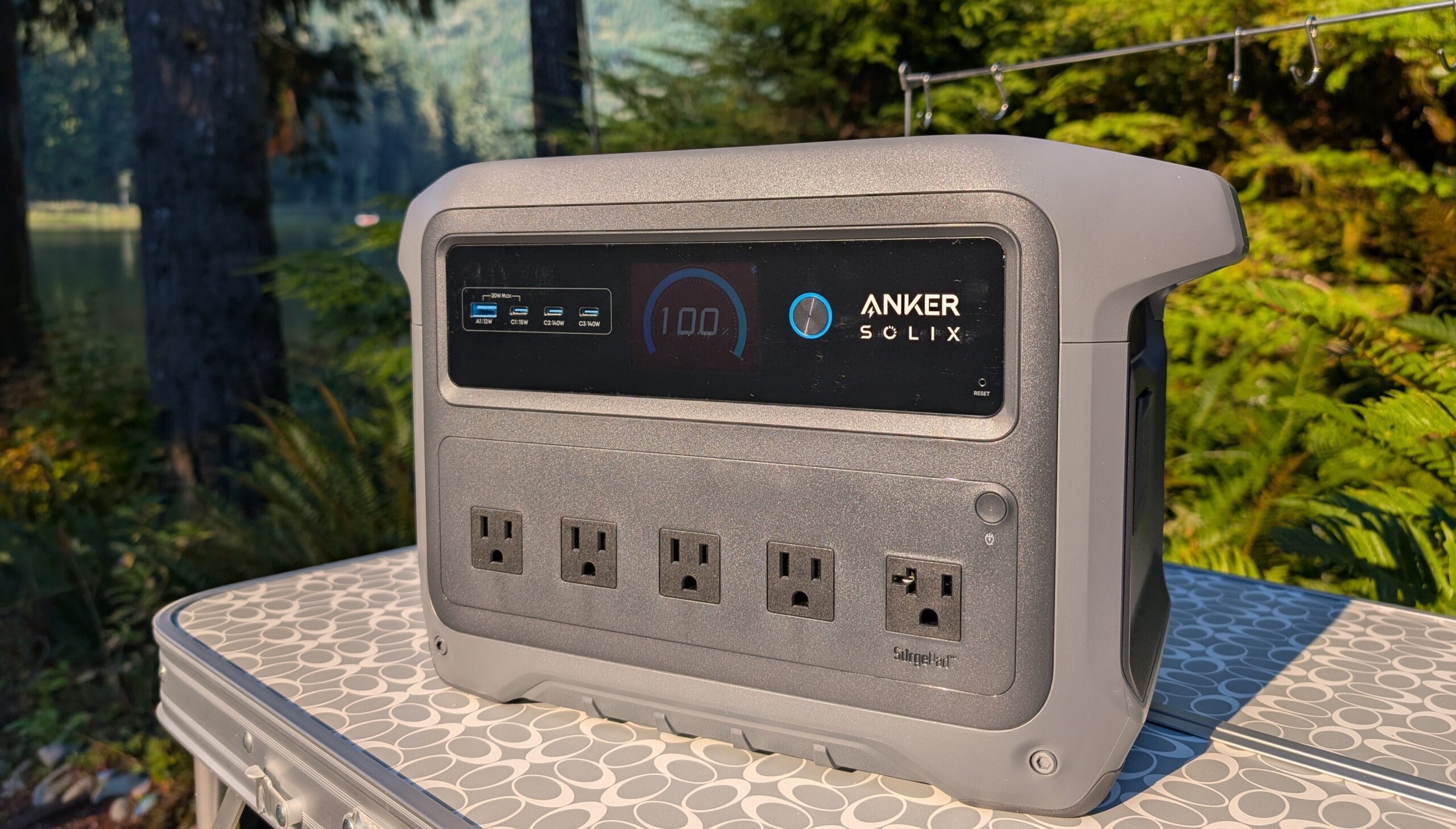 the anker solix c1000 gen 2 on a camping table in the woods