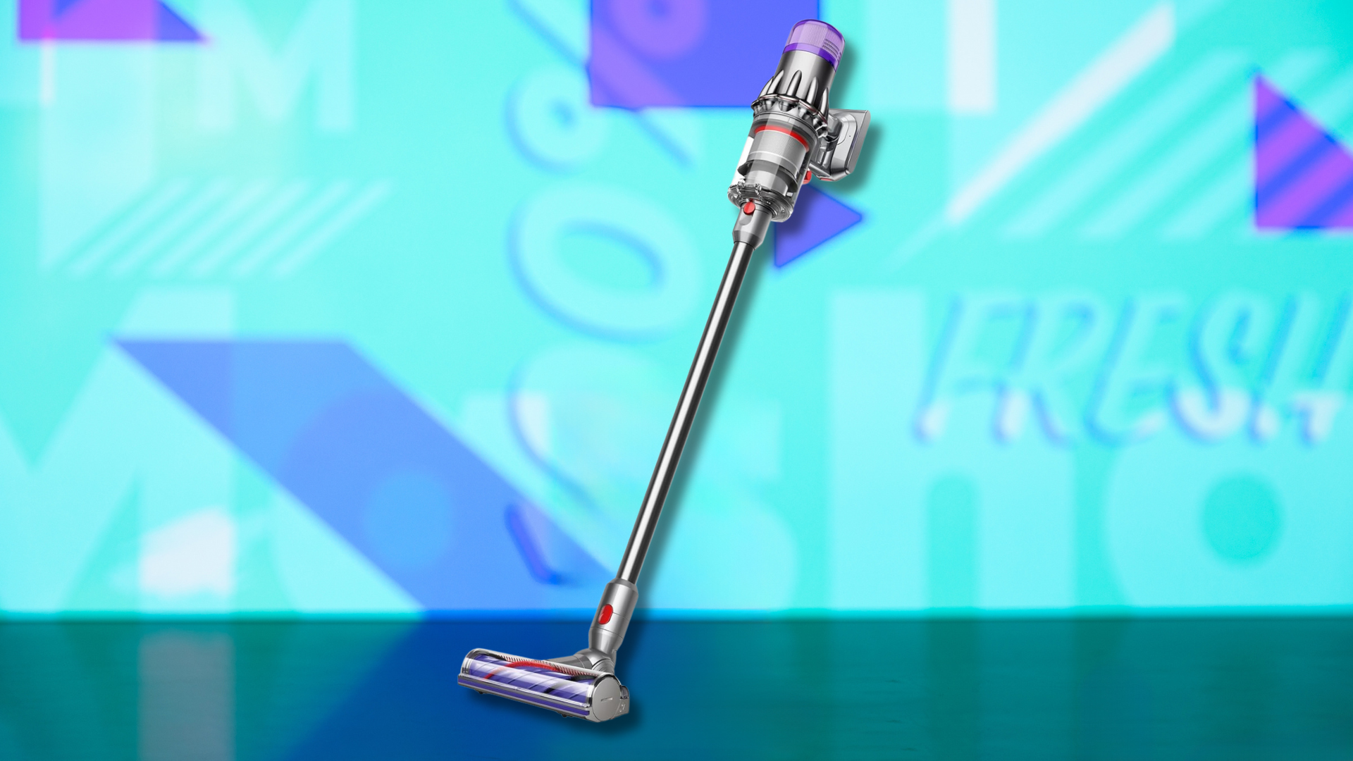 A Dyson V9 Motorbar vacuum on a colorful background