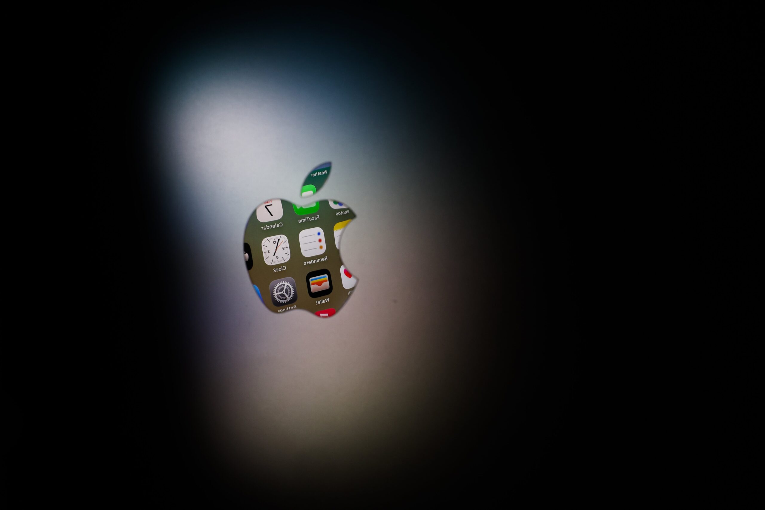 apple logo with screen behind it