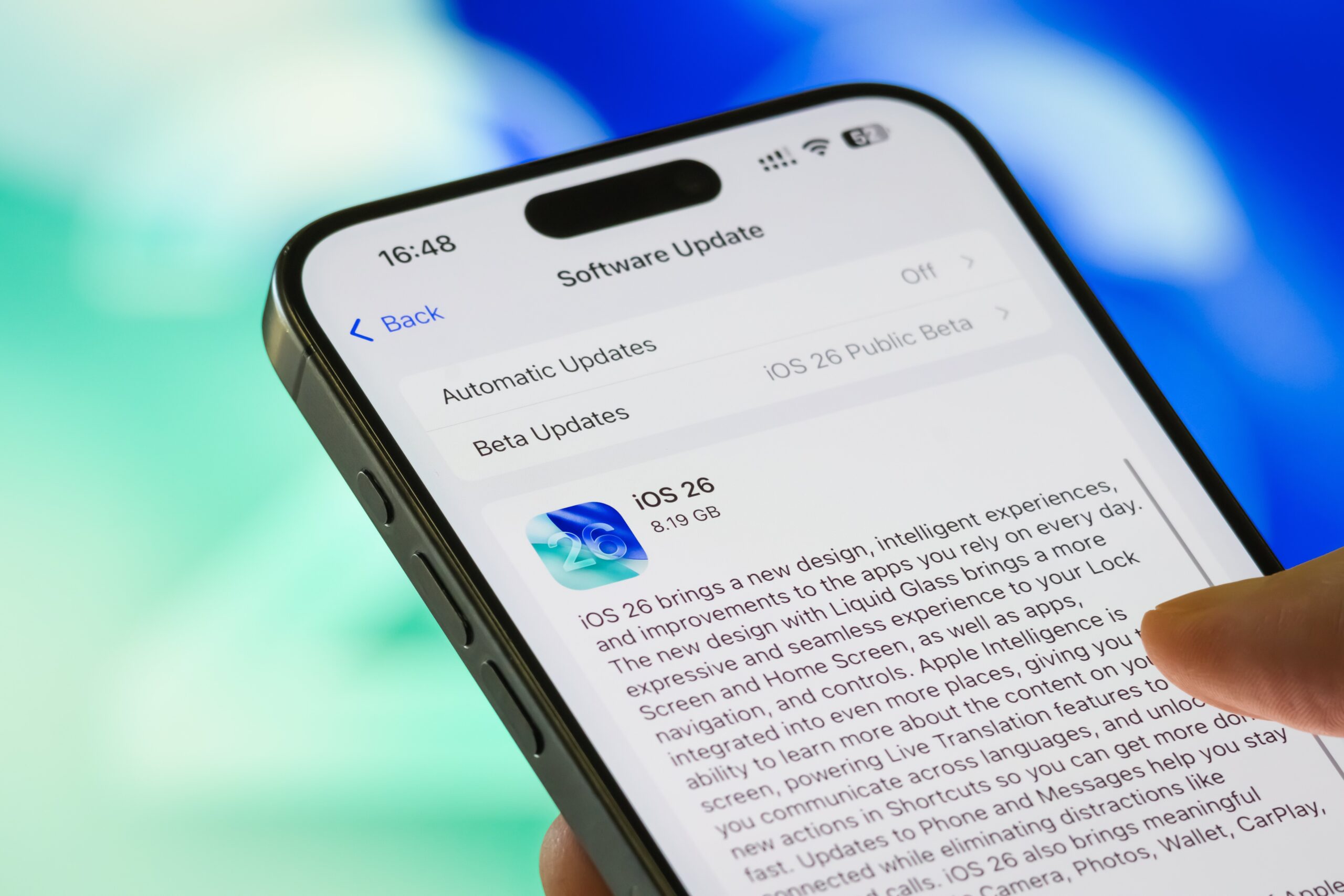  In this photo illustration, an Apple iPhone displays the system-pushed software update to iOS 26 in the Settings app