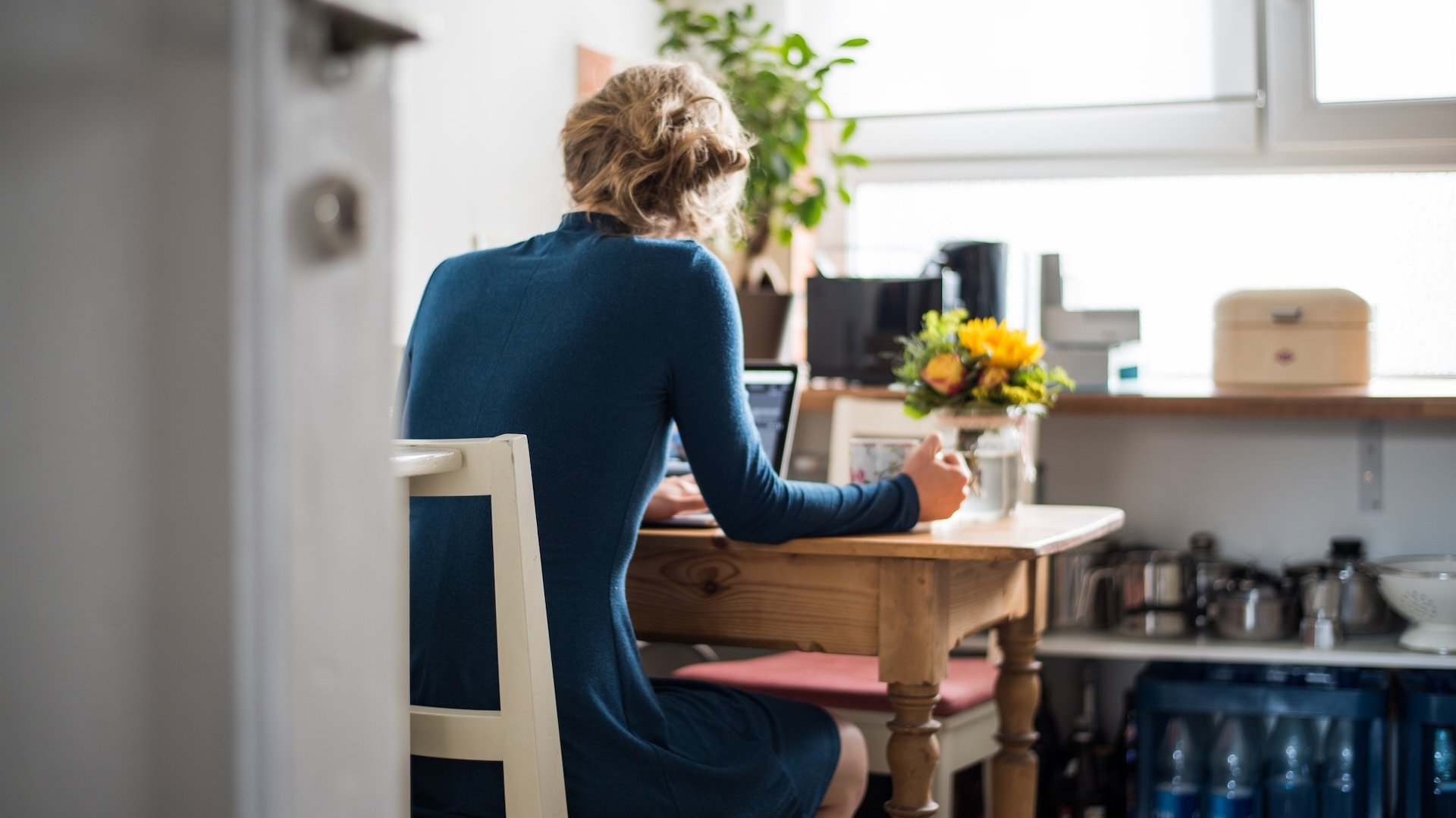 A woman at her laptop.