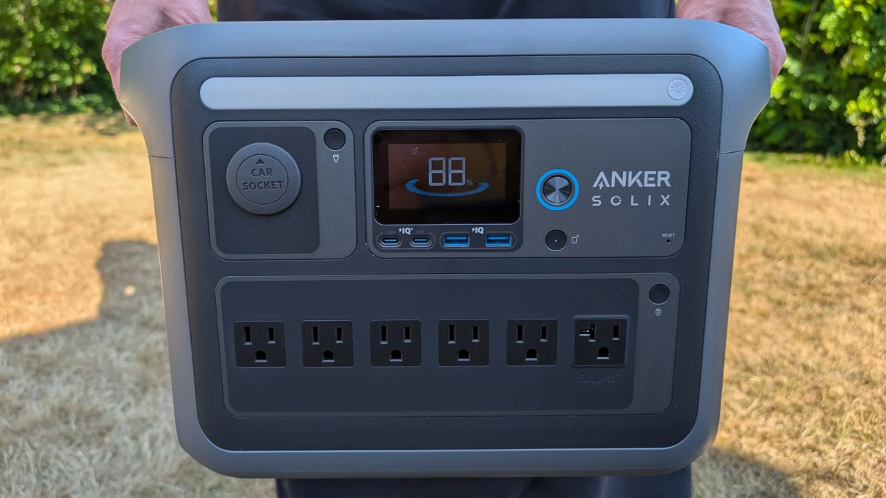 person holding anker solix portable power station