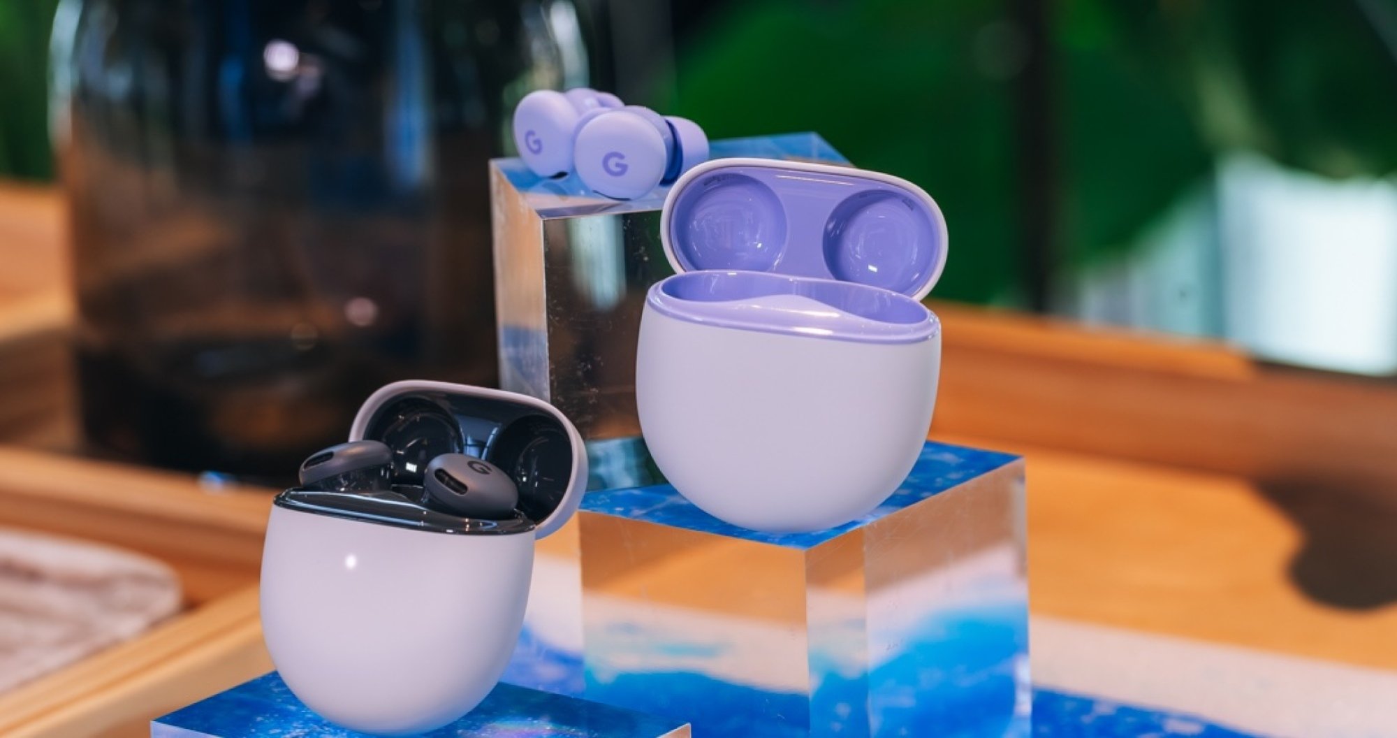 Purple and black pixel earbuds in cases