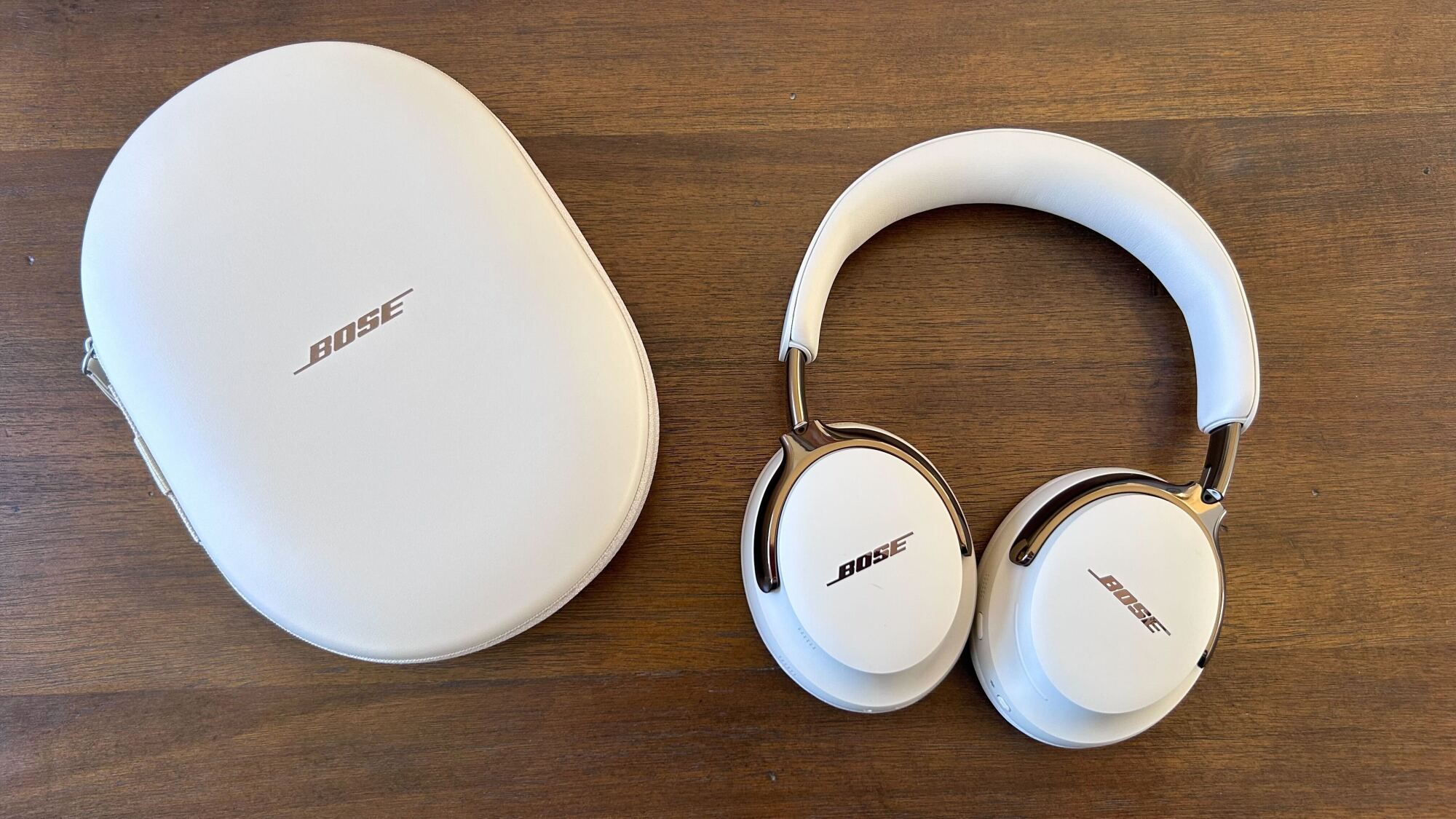 bose qc ultra headphones and case on table