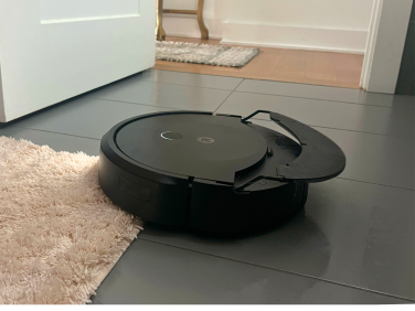 iRobot Roomba Combo 10 Max lifting mopping pad over bath rug
