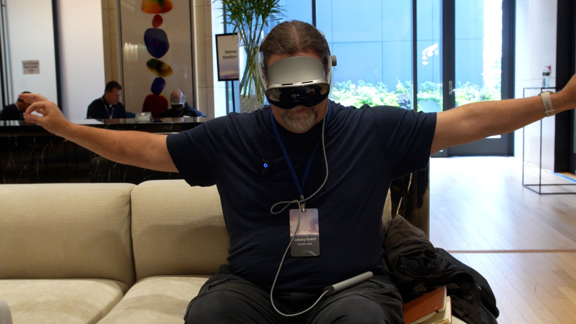 journalist adam doud wearing galaxy xr headset and using hand controls