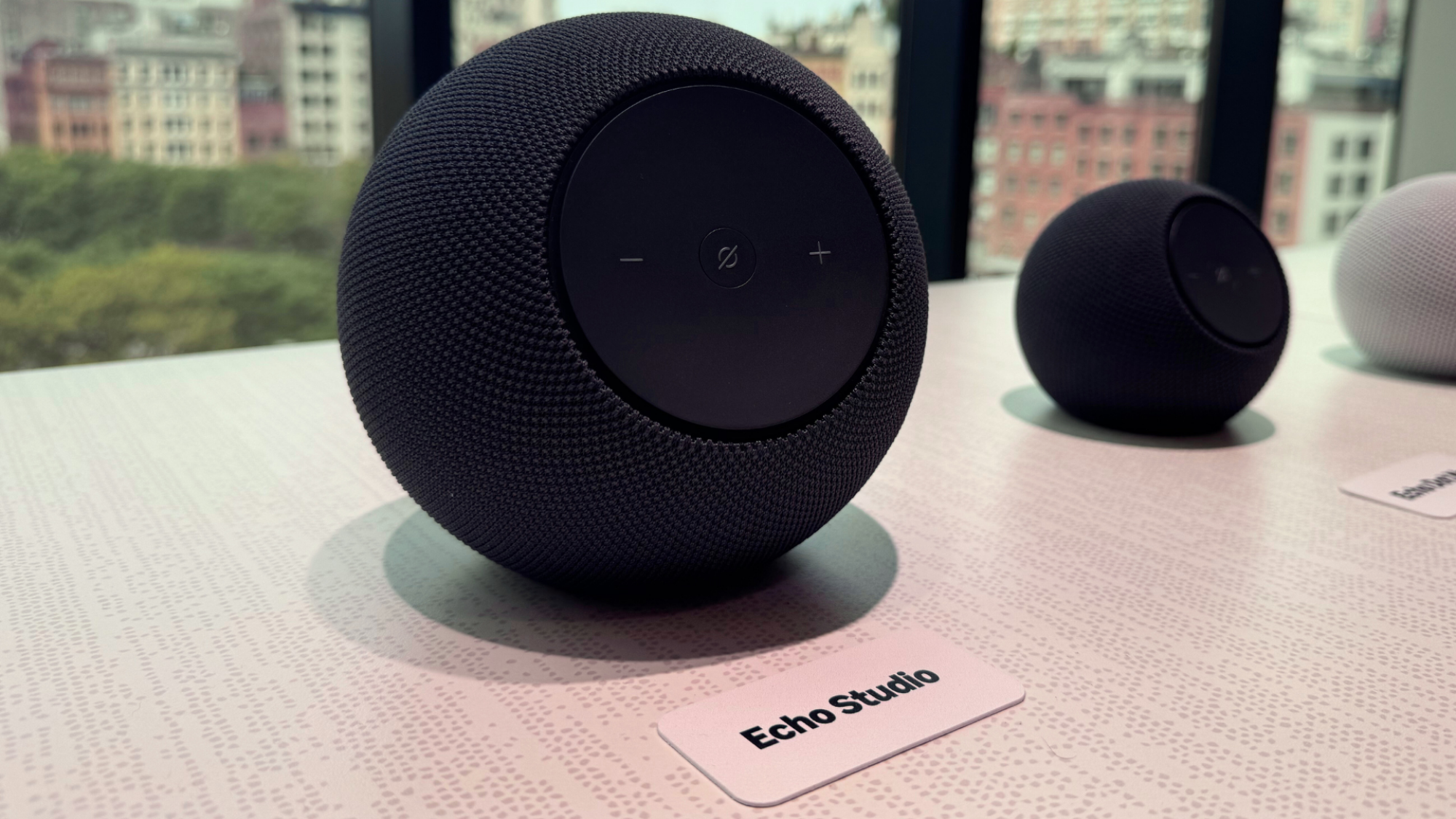An Amazon Echo Studio on a table.