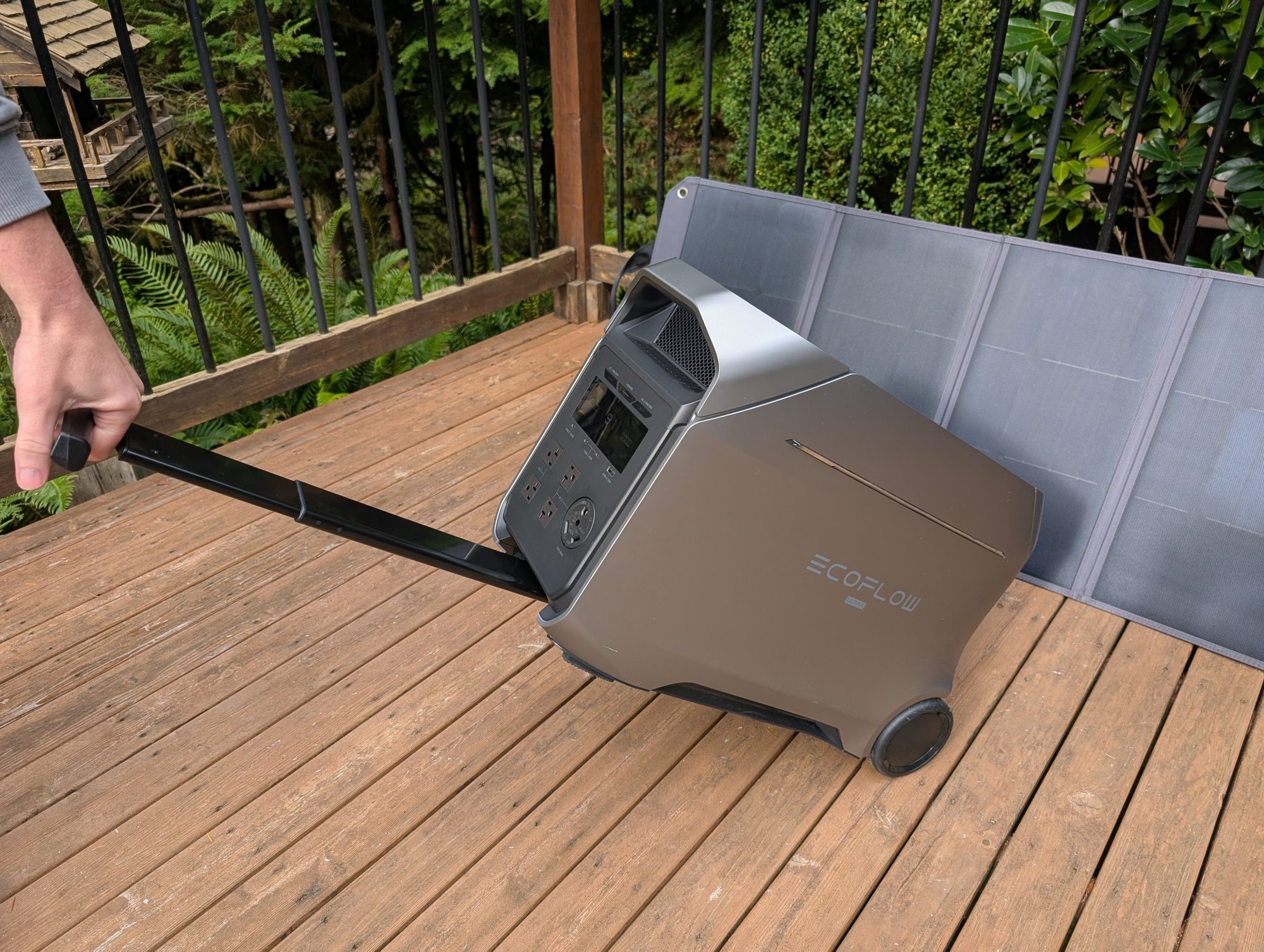 the ecoflow delta 3 ultra plus getting rolled in front of a solar panel