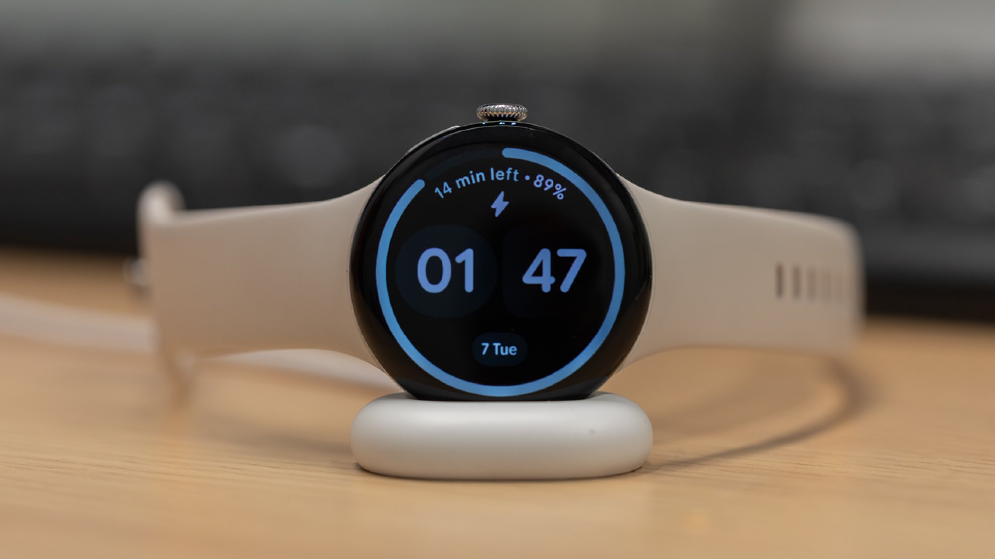 pixel watch 4 on charging stand with battery readout on display