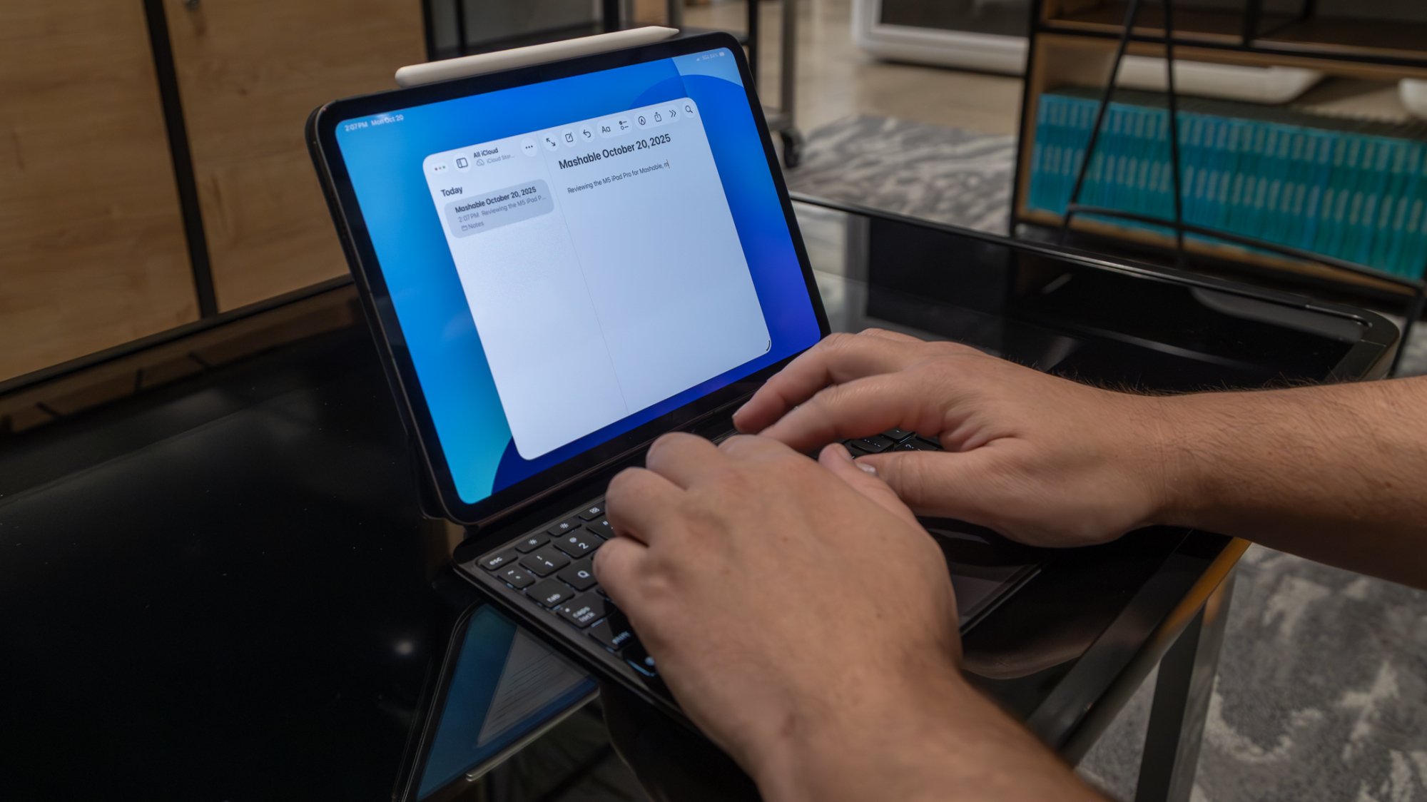 person typing on ipad pro with magic keyboard