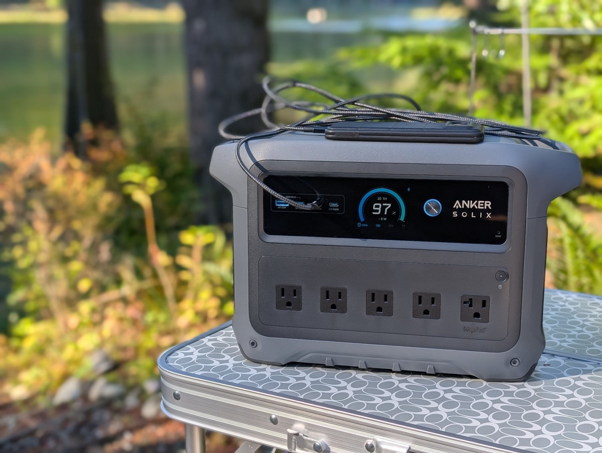 the anker solix c1000 gen 2 recharges a phone in the woods
