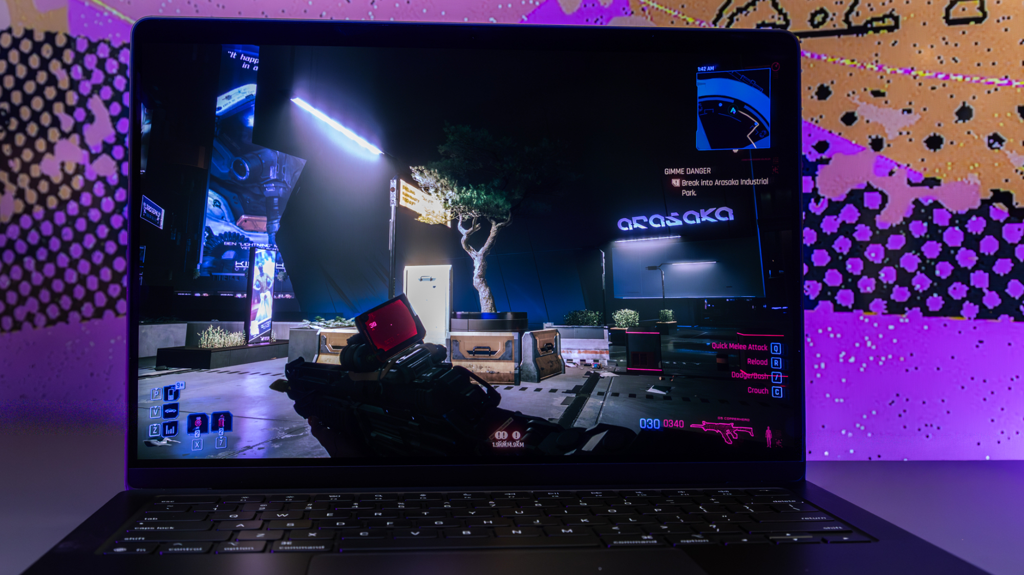 cyberpunk 2077 being played on the m5 macbook pro display