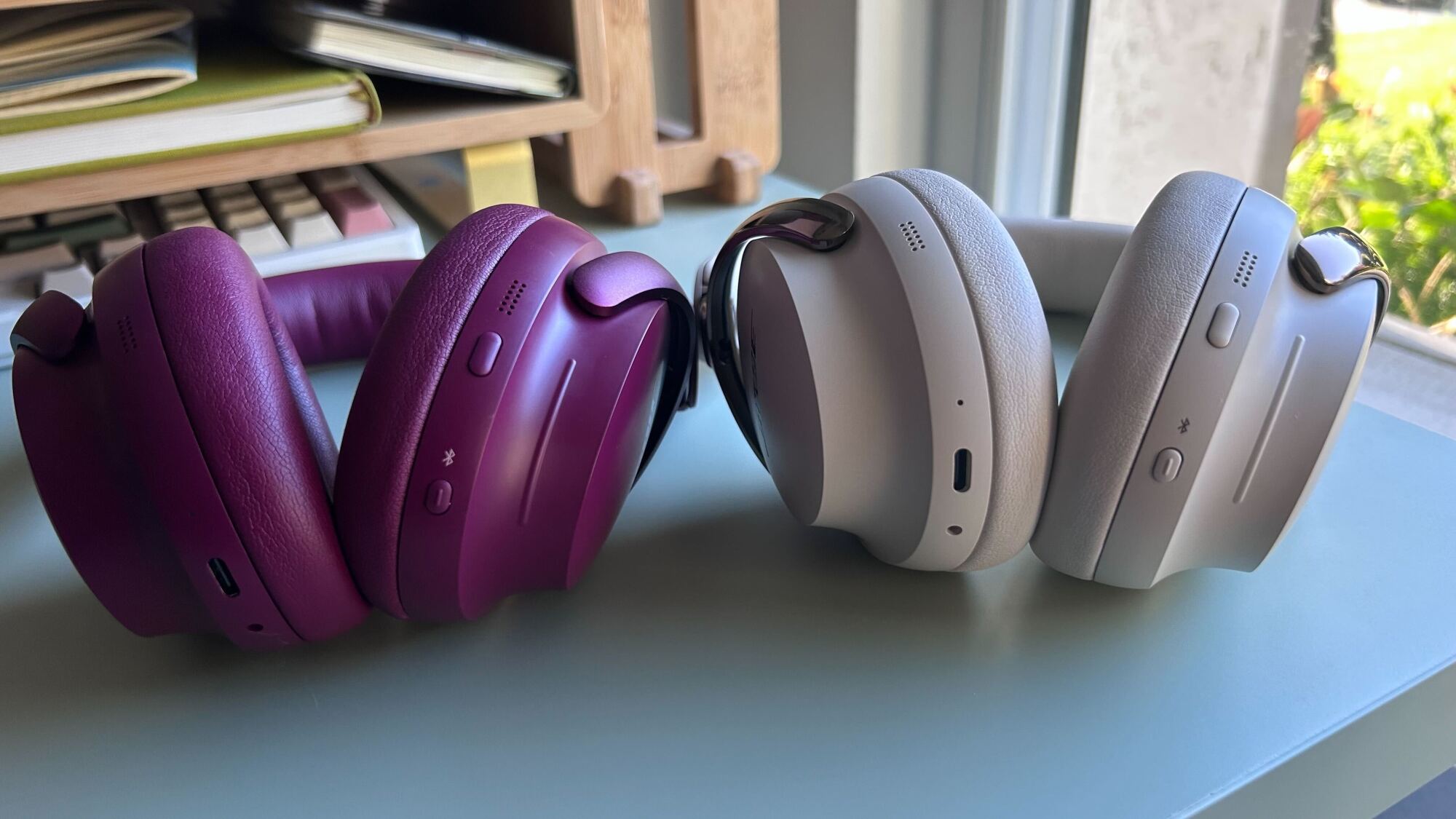 the bottom of two pairs of bose headphones side by side