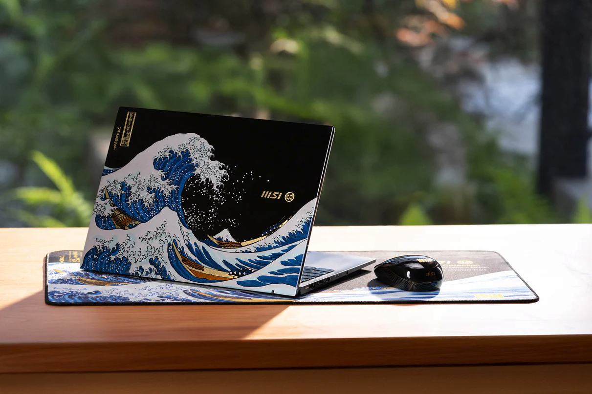 MSI Prestige Ukiyoe edition laptop and mouse sitting on desk