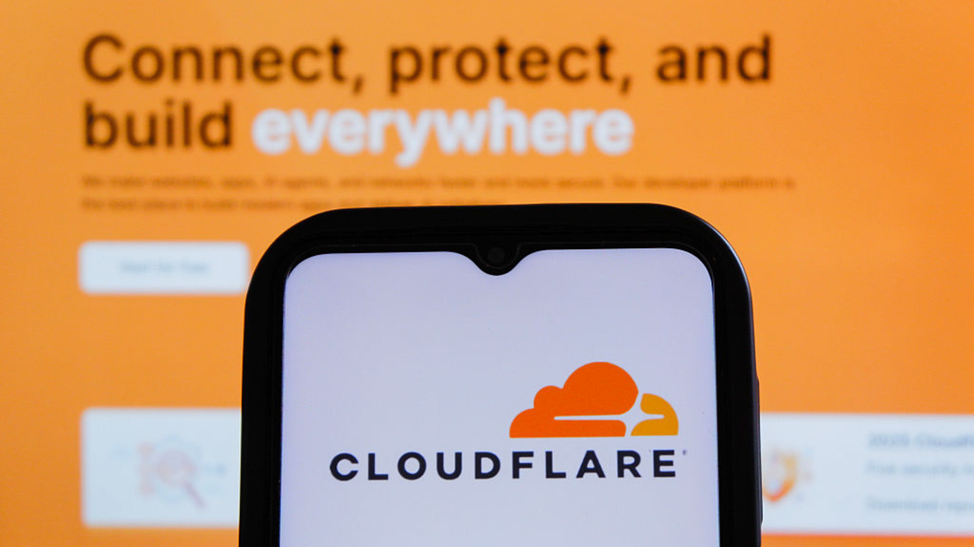 A Cloudflare logo is displayed on a smartphone.